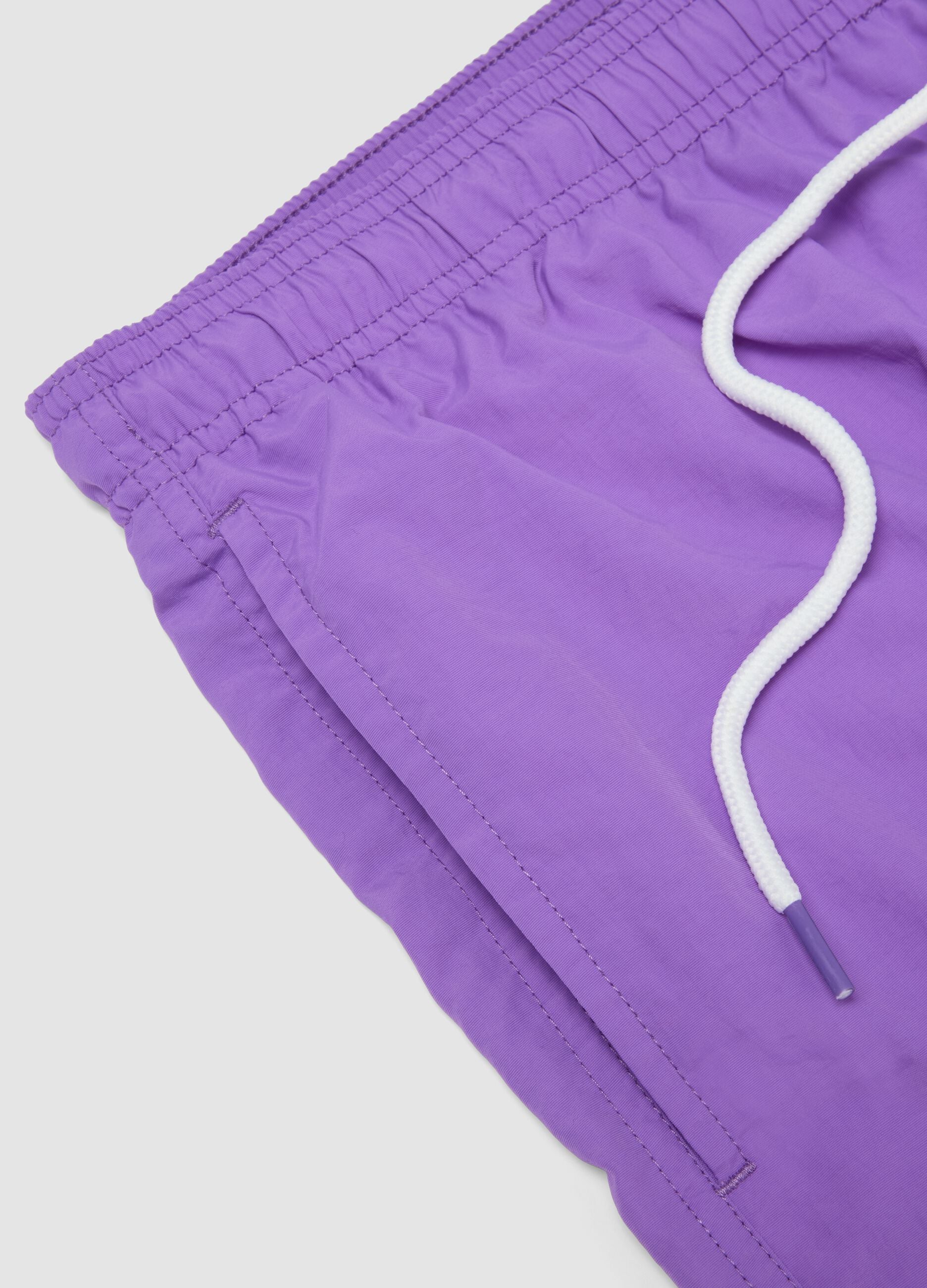 Purple swim shorts with elasticated waistband