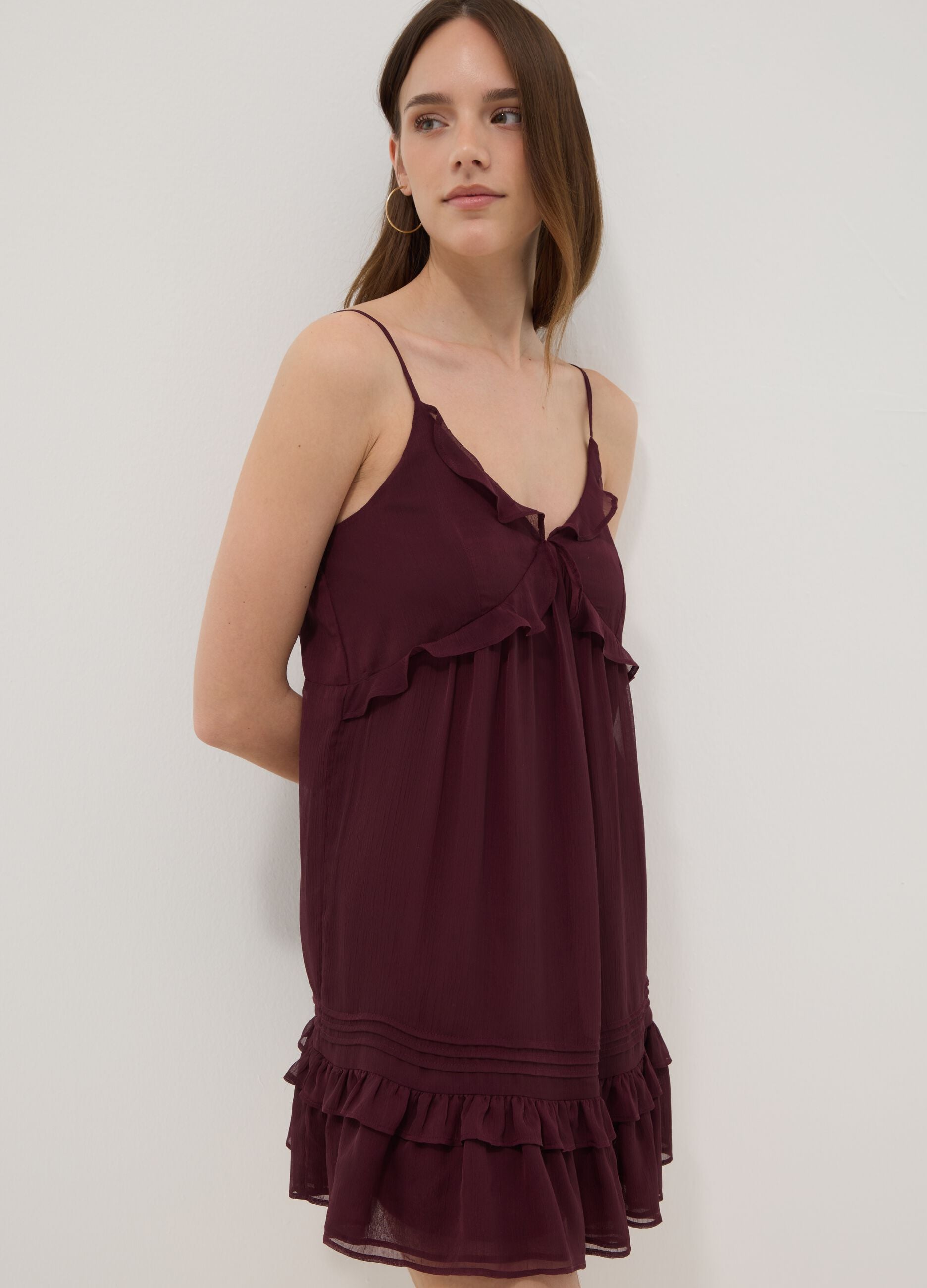 Purple mini dress with ruffles and plunging neckline
