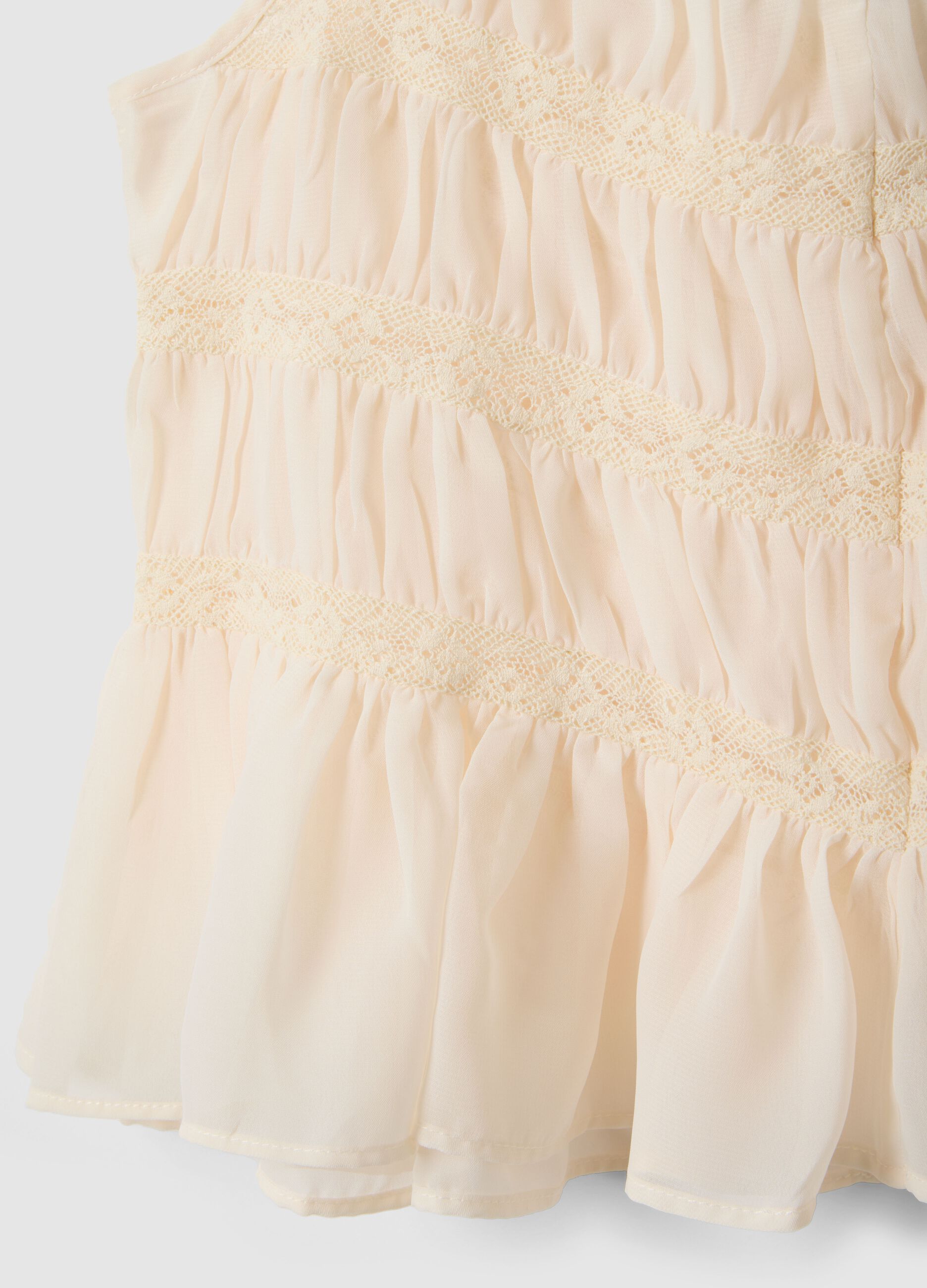 Sleeveless top with ruffled shirring and crochet lace inserts