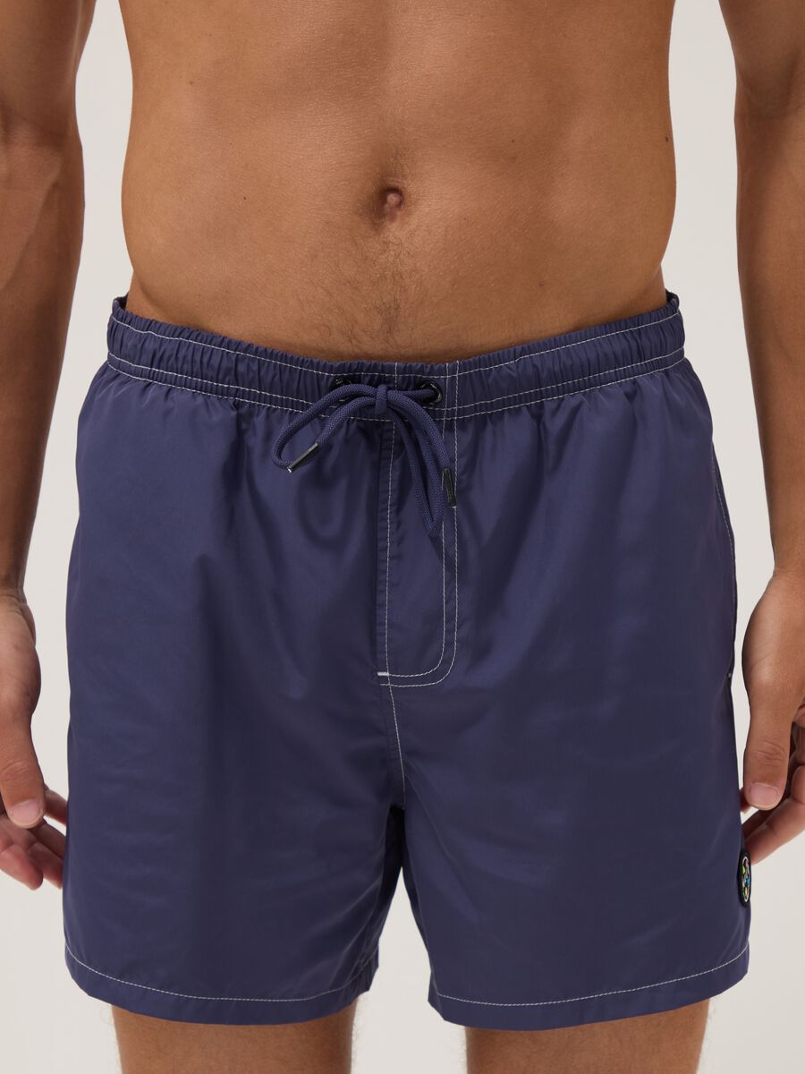 Blue swim shorts with drawstring waist_1