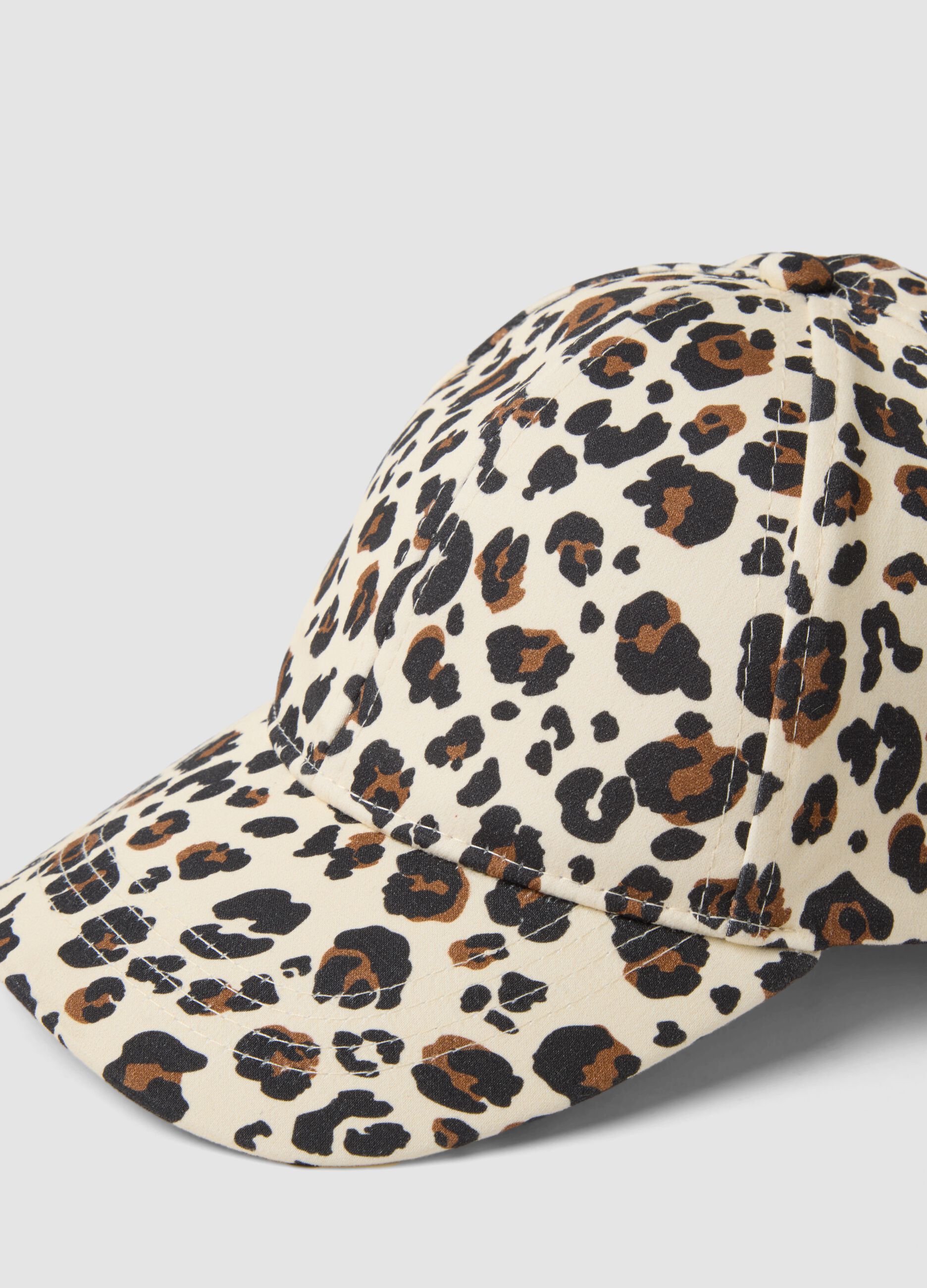 Beige stretch cotton cap with animal print
