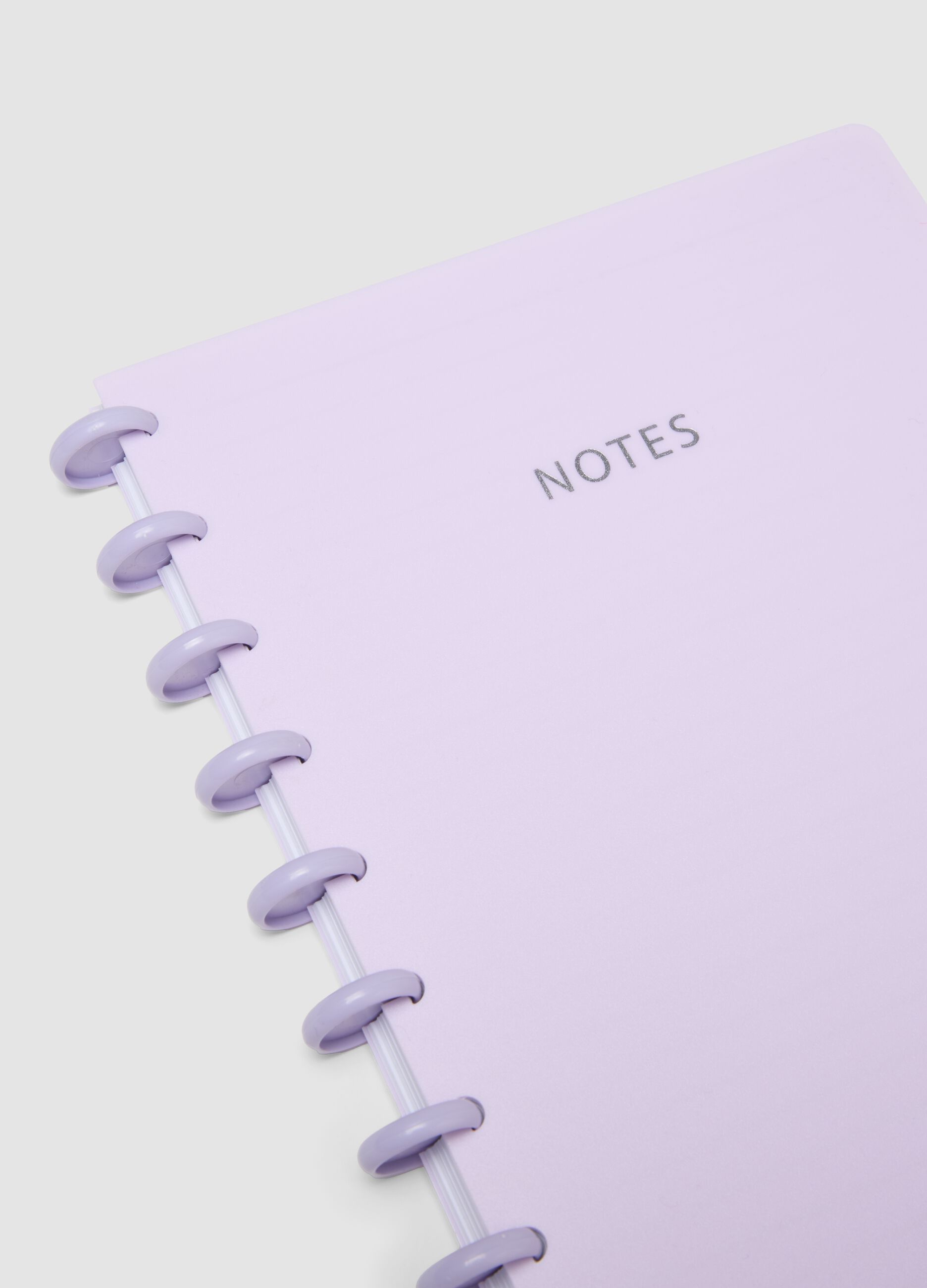 Purple notebook with lined pages in rigid cardboard with spiral