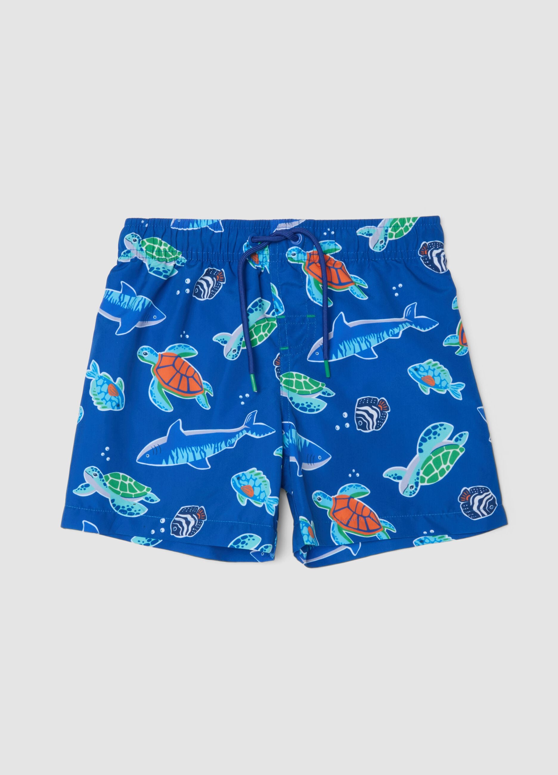 Blue boys&rsquo; swim shorts with ocean print