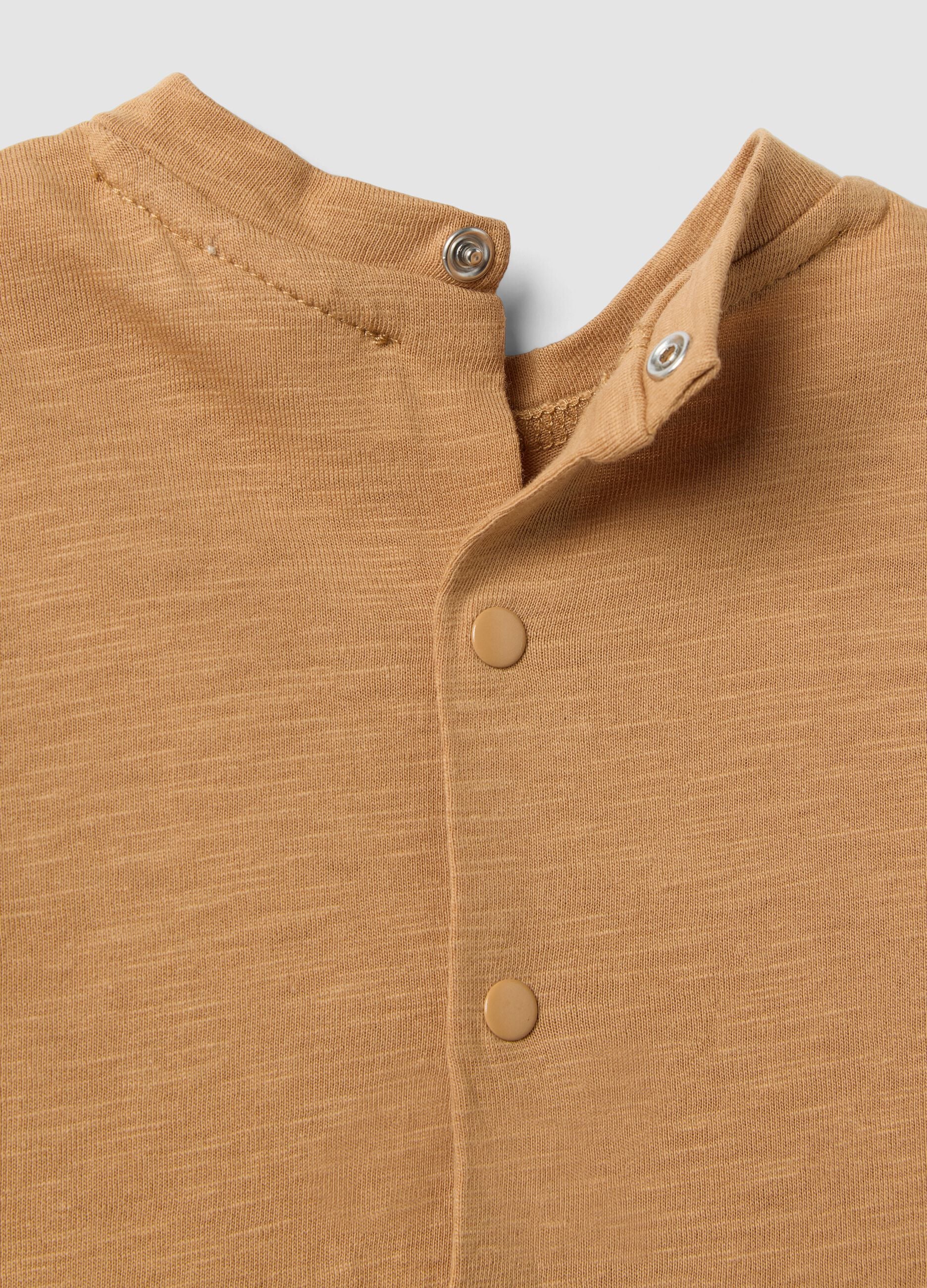 Brown stretch cotton and linen baby romper with lion motif