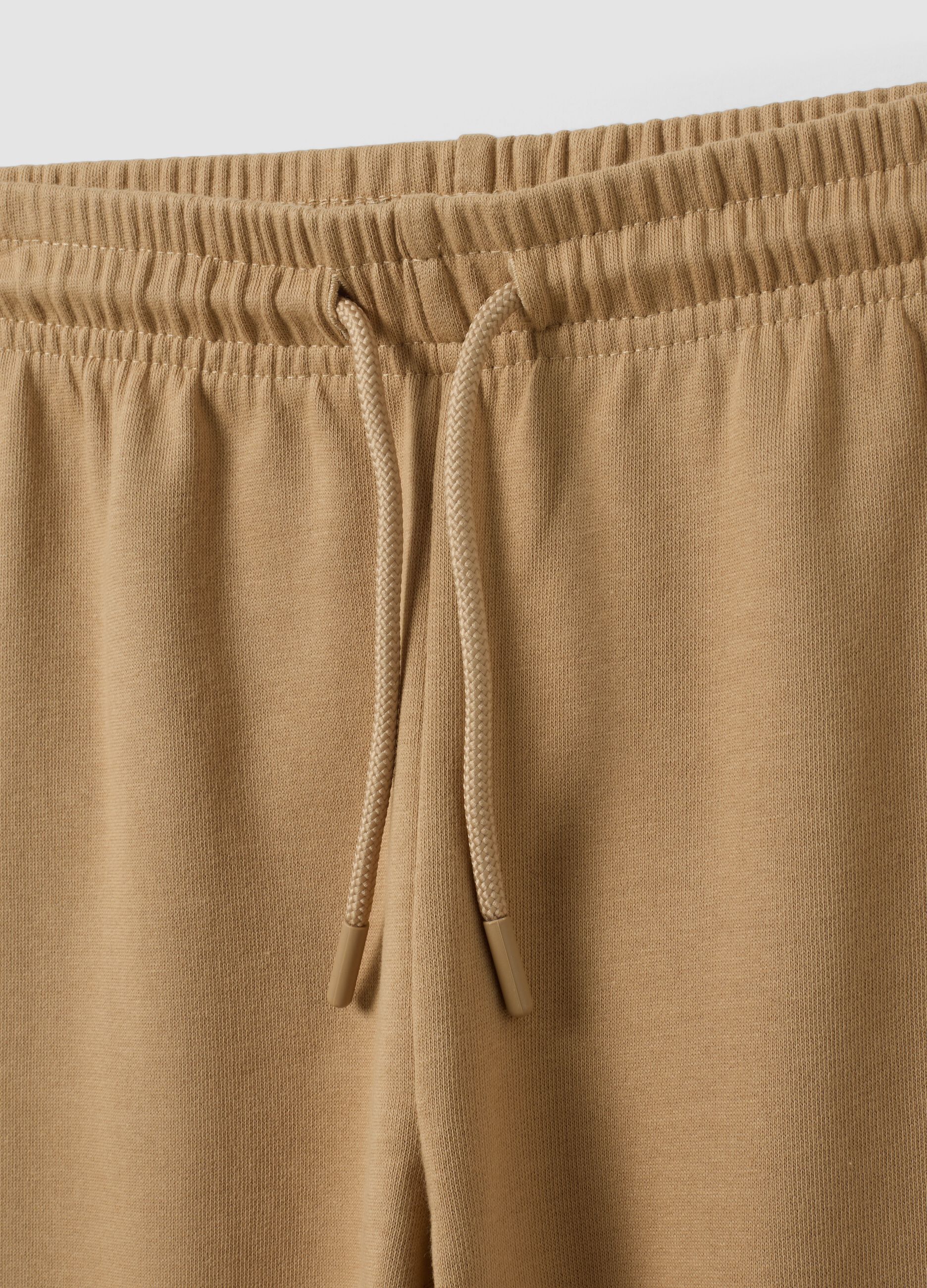 Beige regular-fit joggers in pure organic cotton for boys