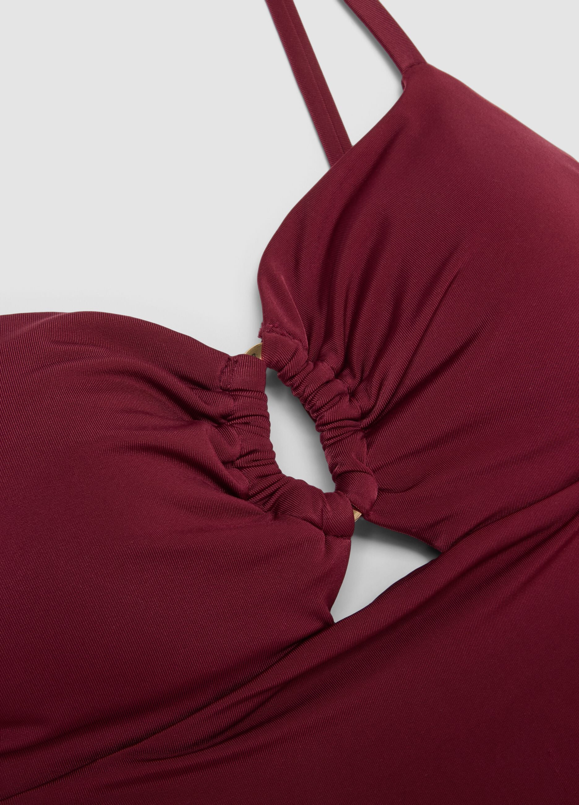Red stretchy one-piece swimsuit with straps