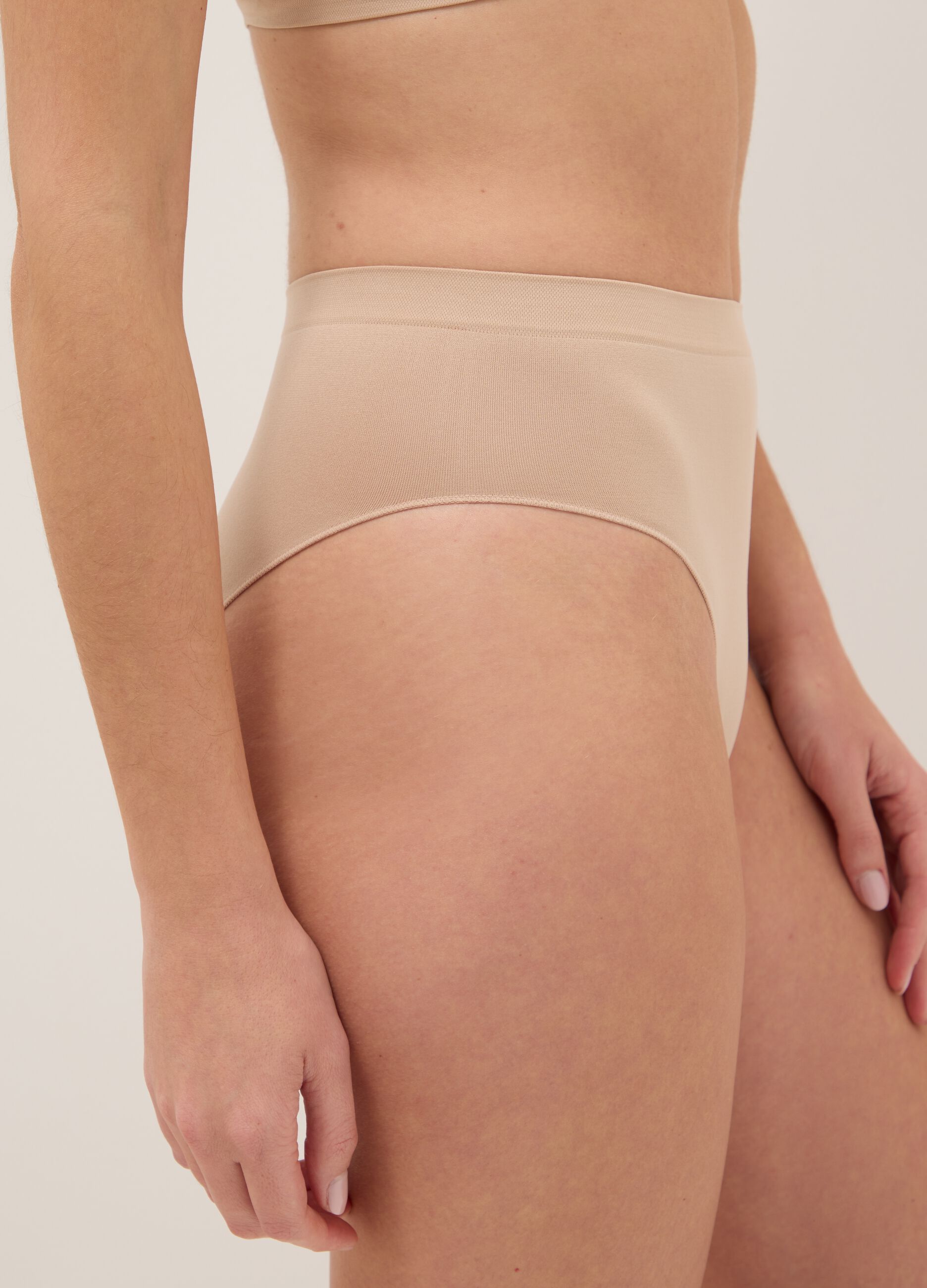 High-waisted stretchy beige fabric briefs