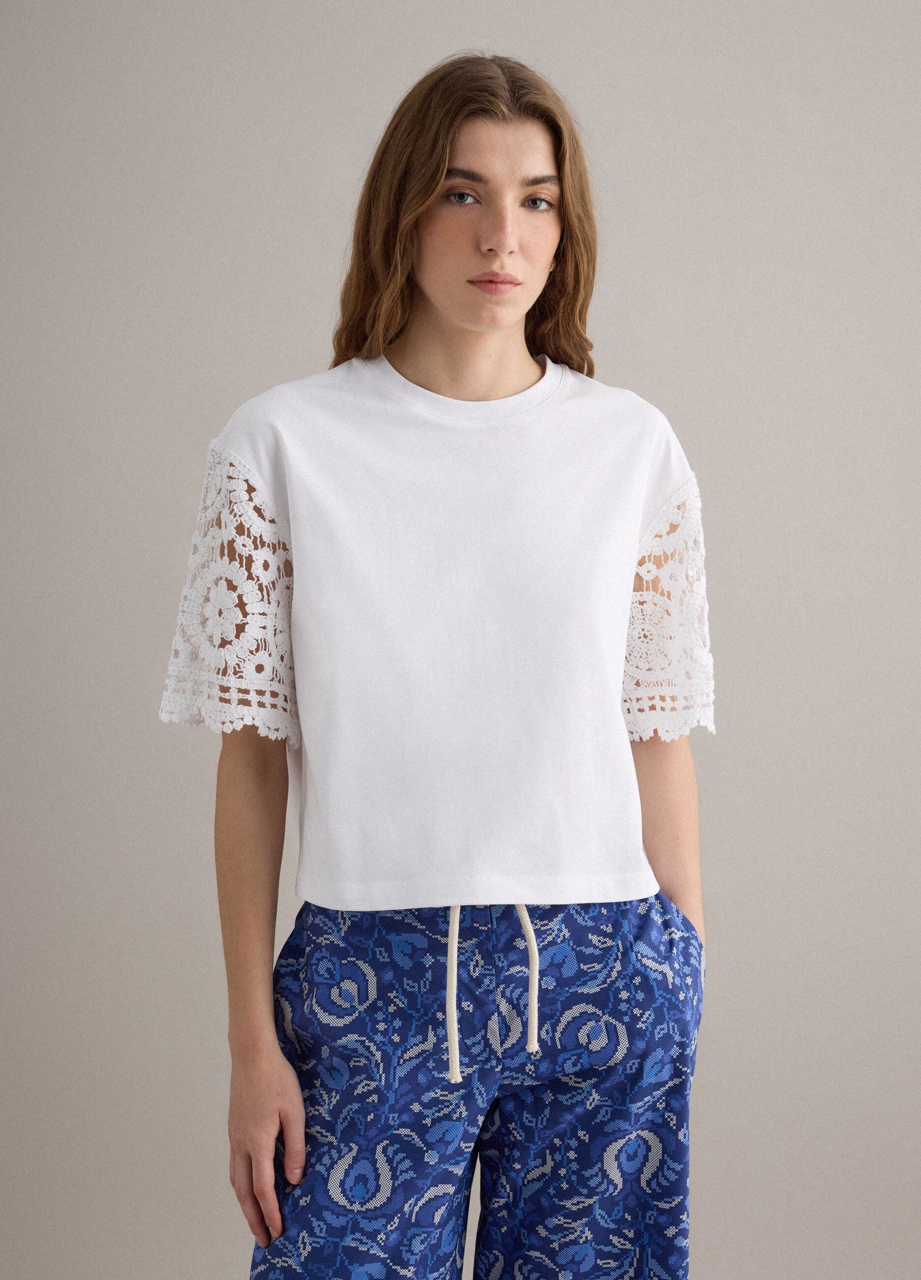 White short-sleeve cotton-blend T-shirt with mesh details