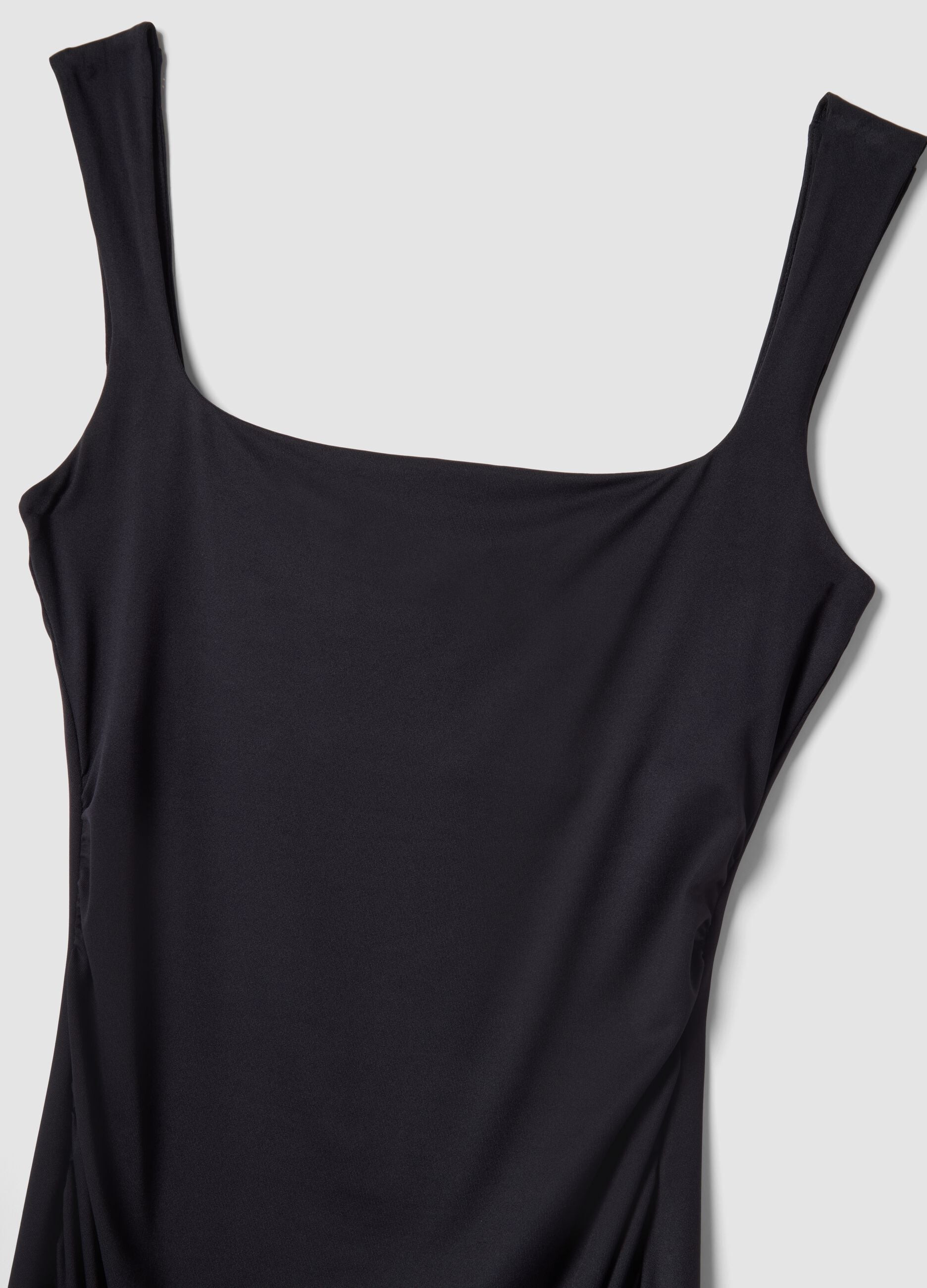 Black fitted dress with square neckline
