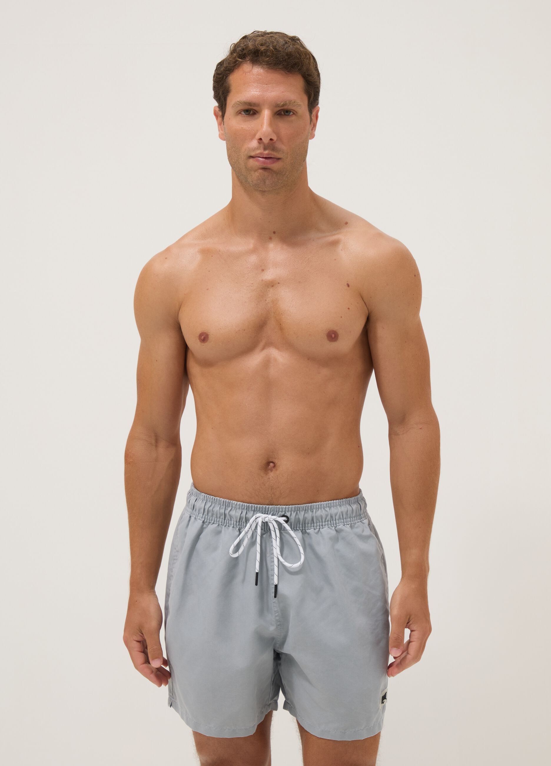 Blue swim shorts with drawstring waist