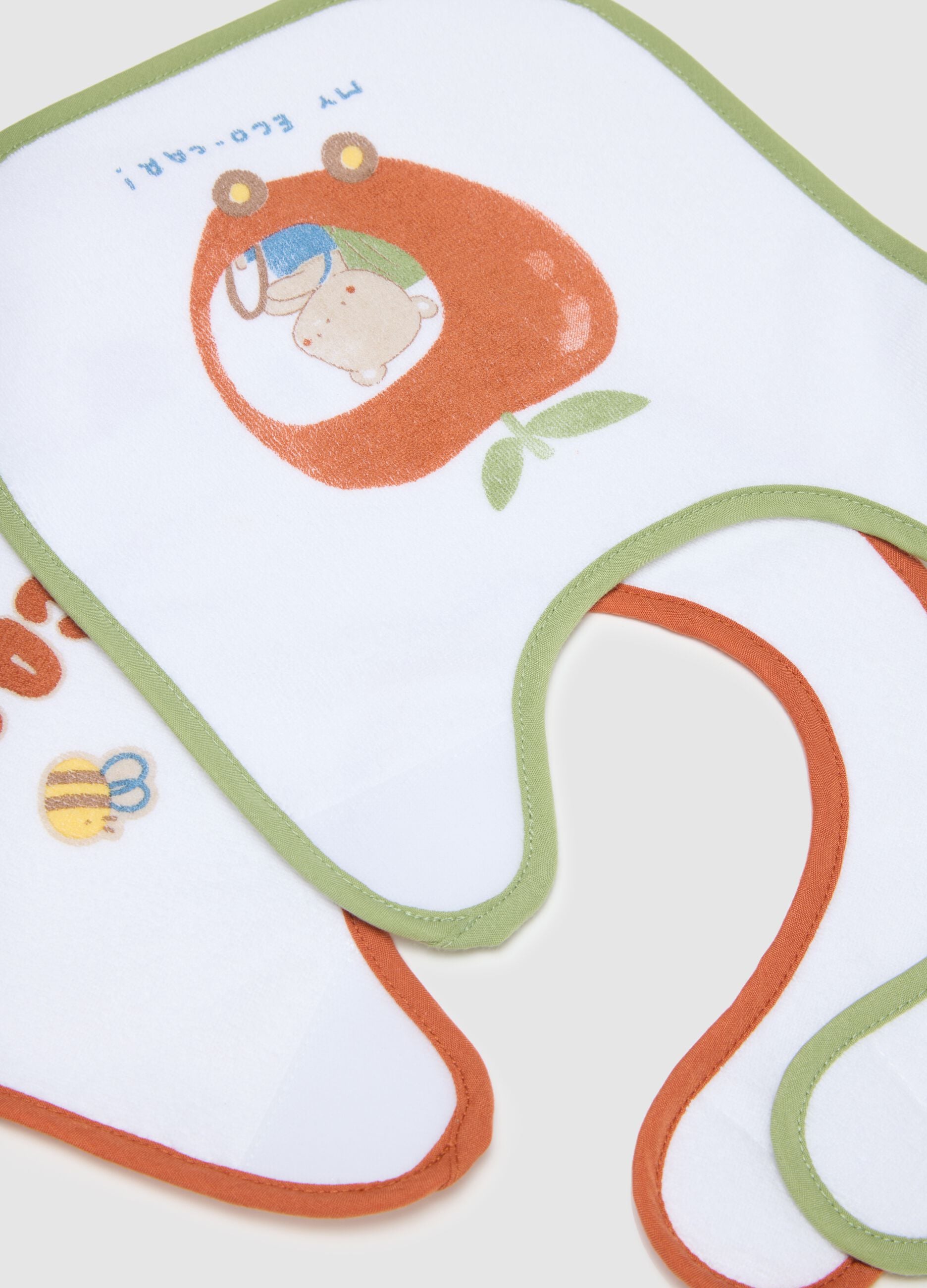 Two-pack white cotton blend bibs with velcro and prints