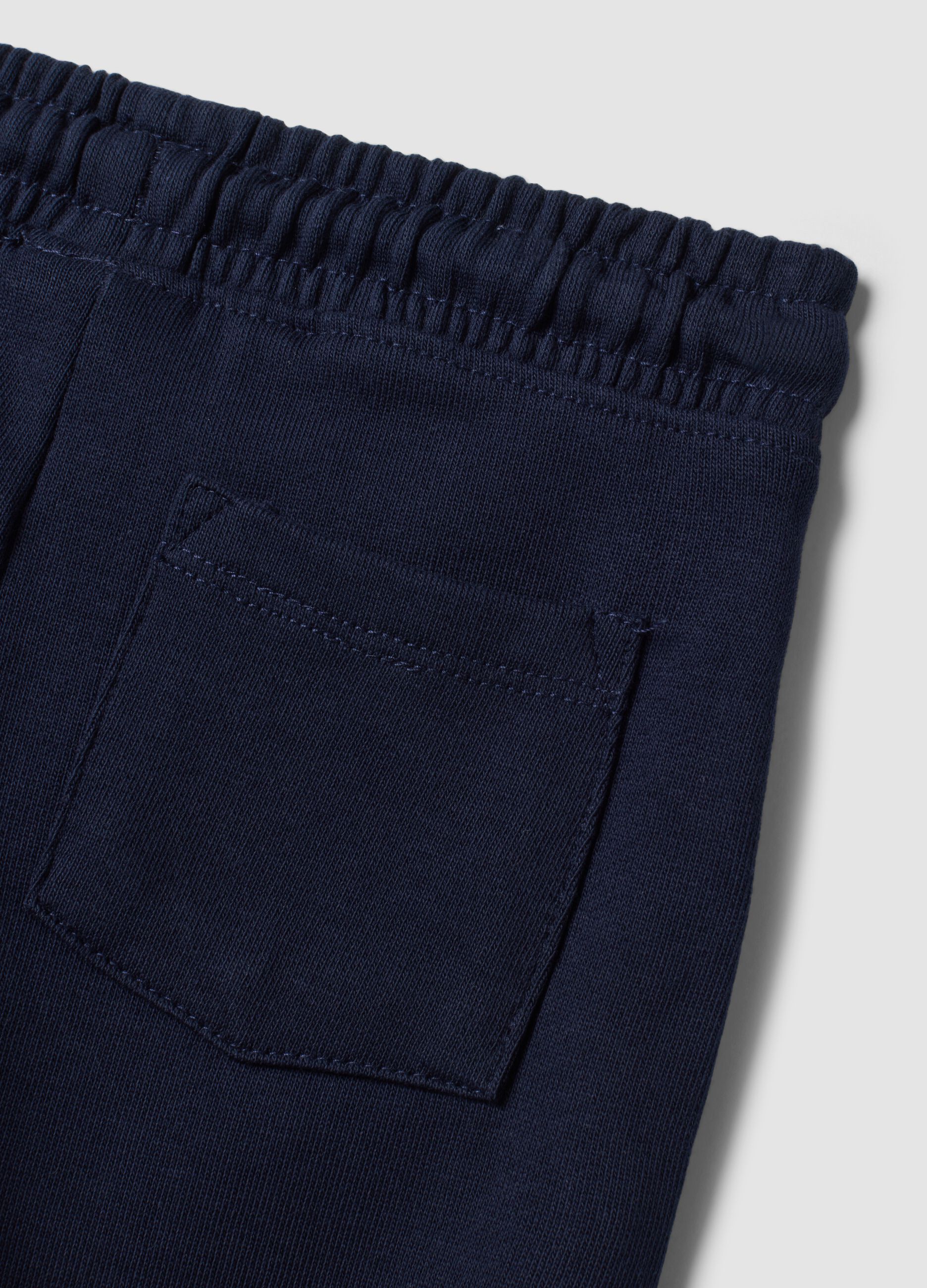 Pantaloni jogger blu in puro cotone con stampa cagnolino per bimbo