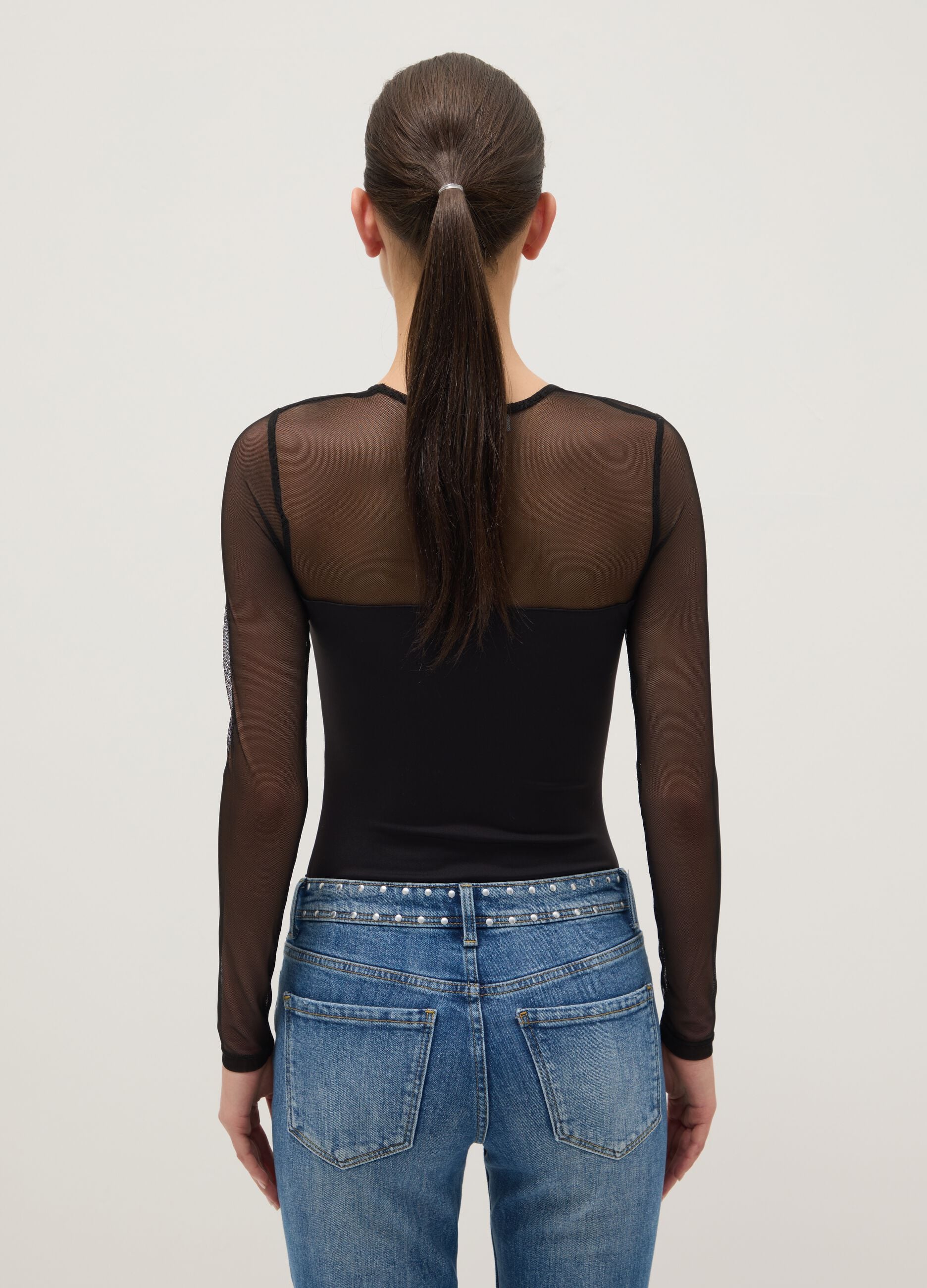 Black slim fit bodysuit with sheer accents