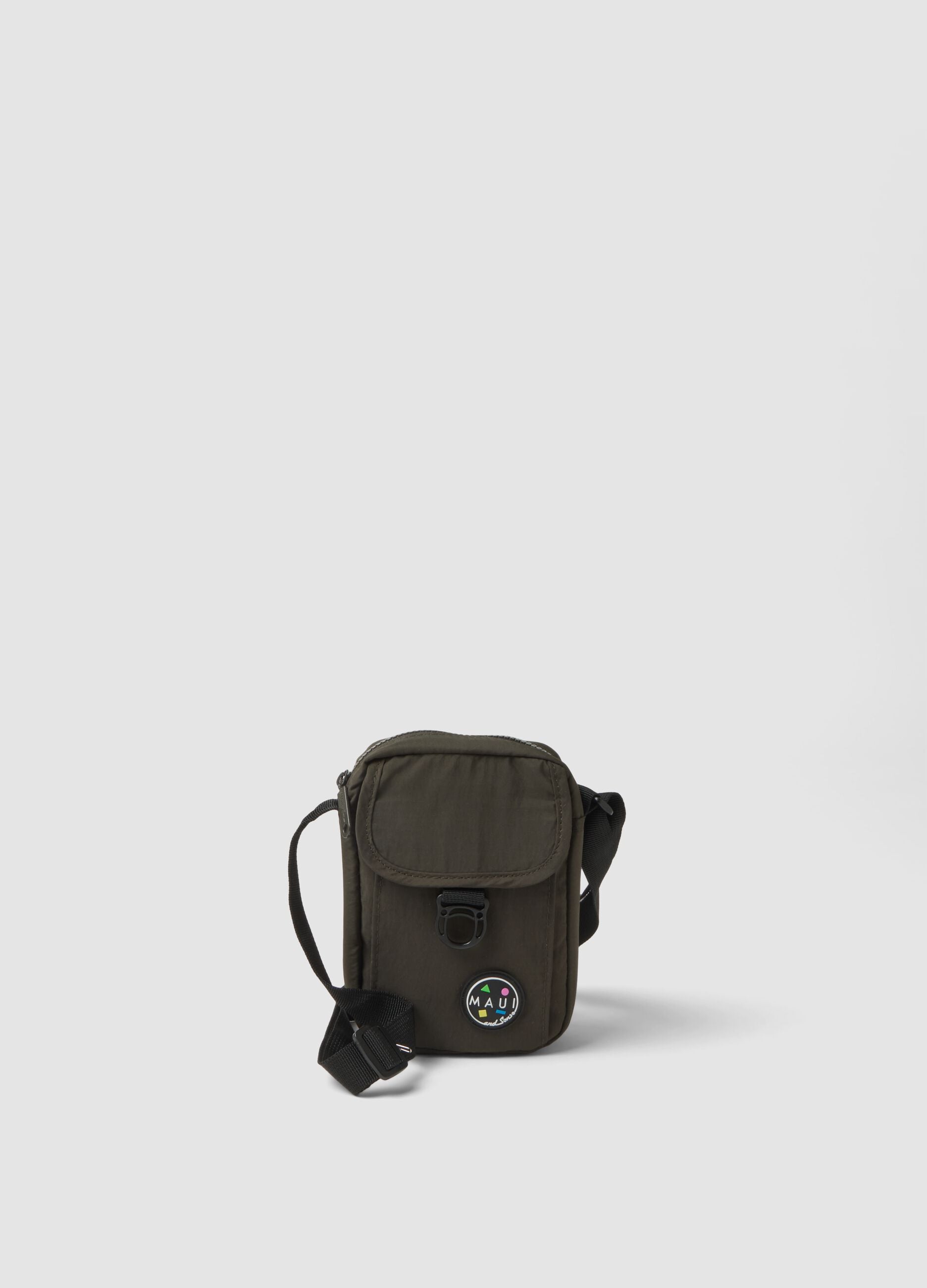 Green crossbody bag with zip closure and adjustable strap