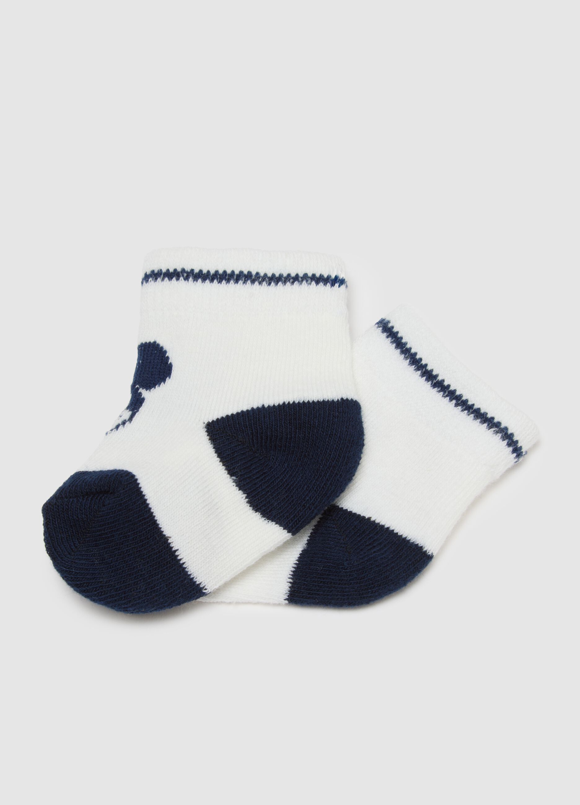 White knitted and cotton baby booties with Mickey Mouse embroidery