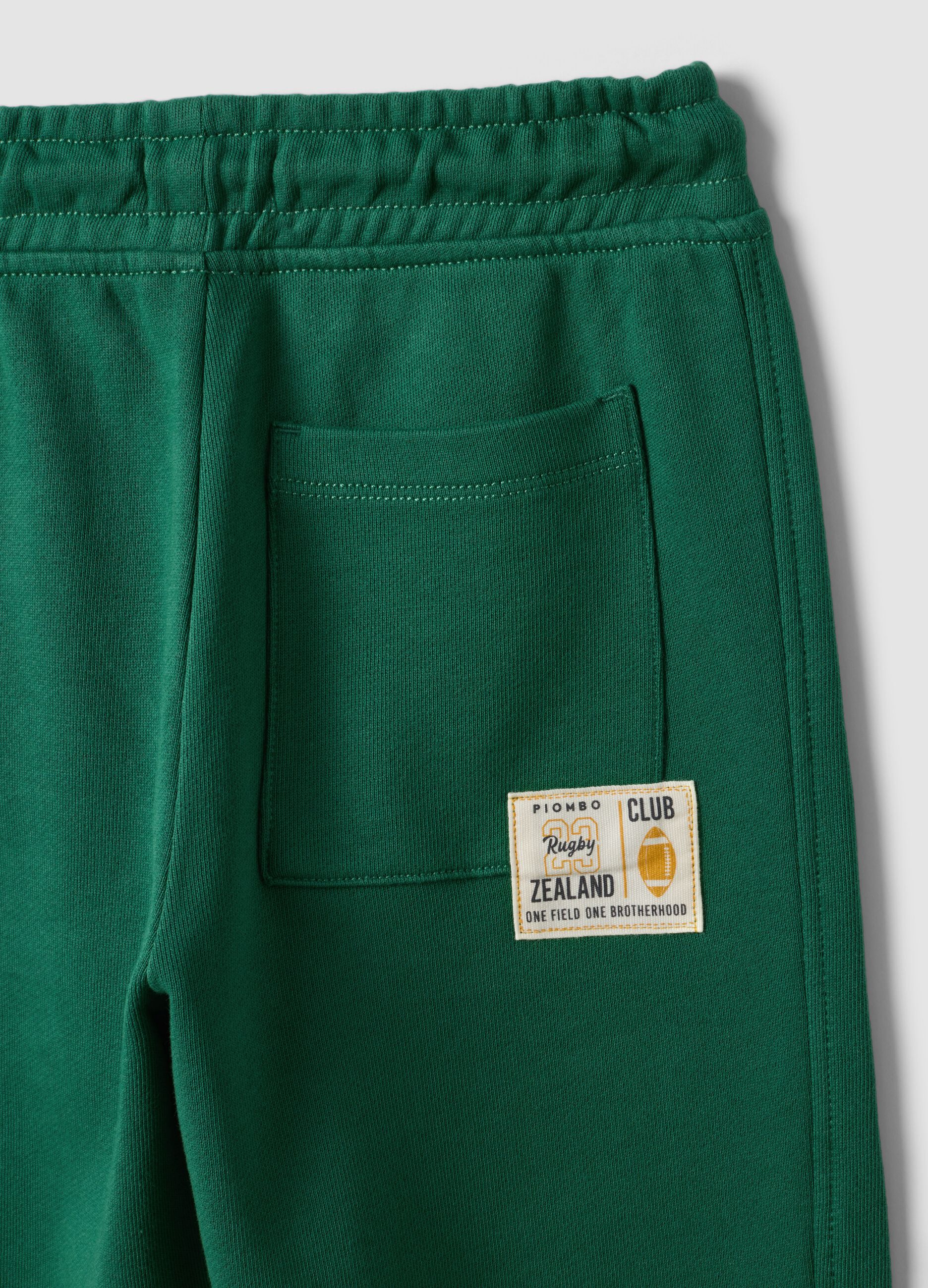 Green pure cotton jogger trousers with elasticated waist for boys