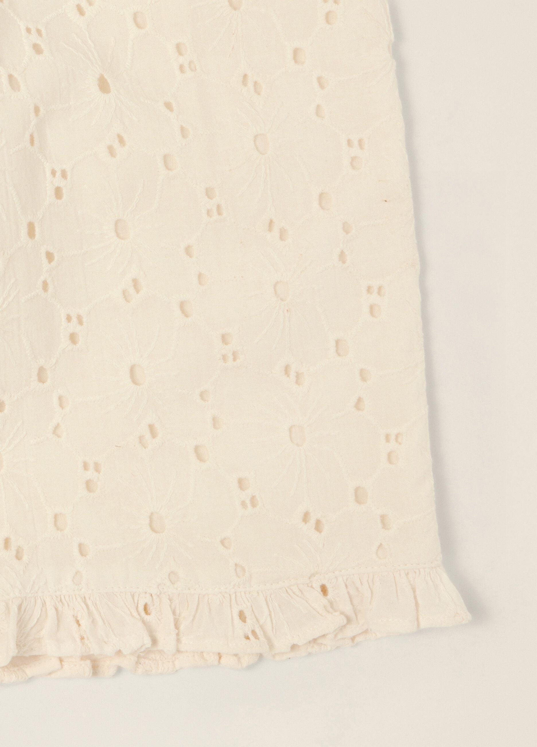 White broderie cotton trousers for baby girls