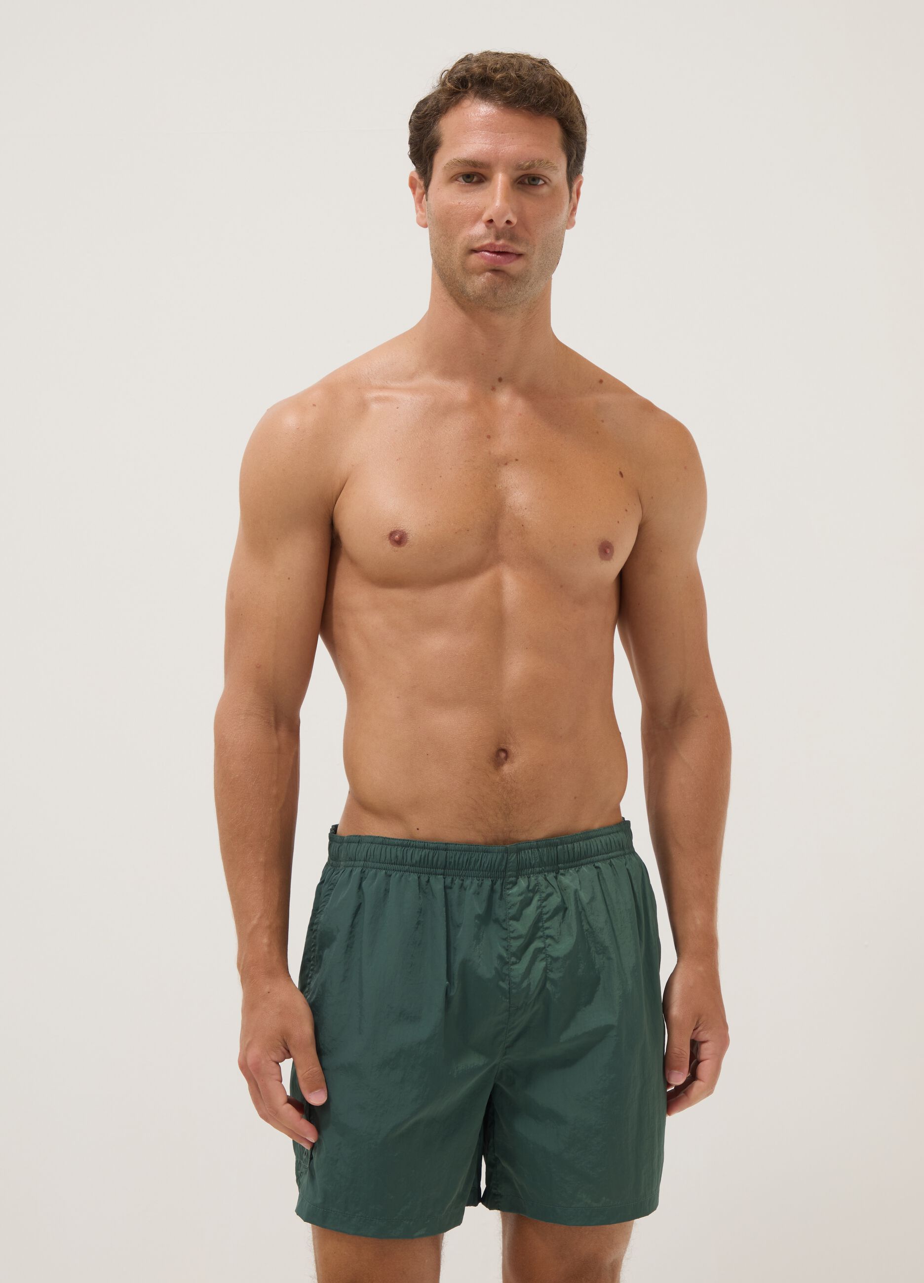 Green swim shorts with elasticated waistband