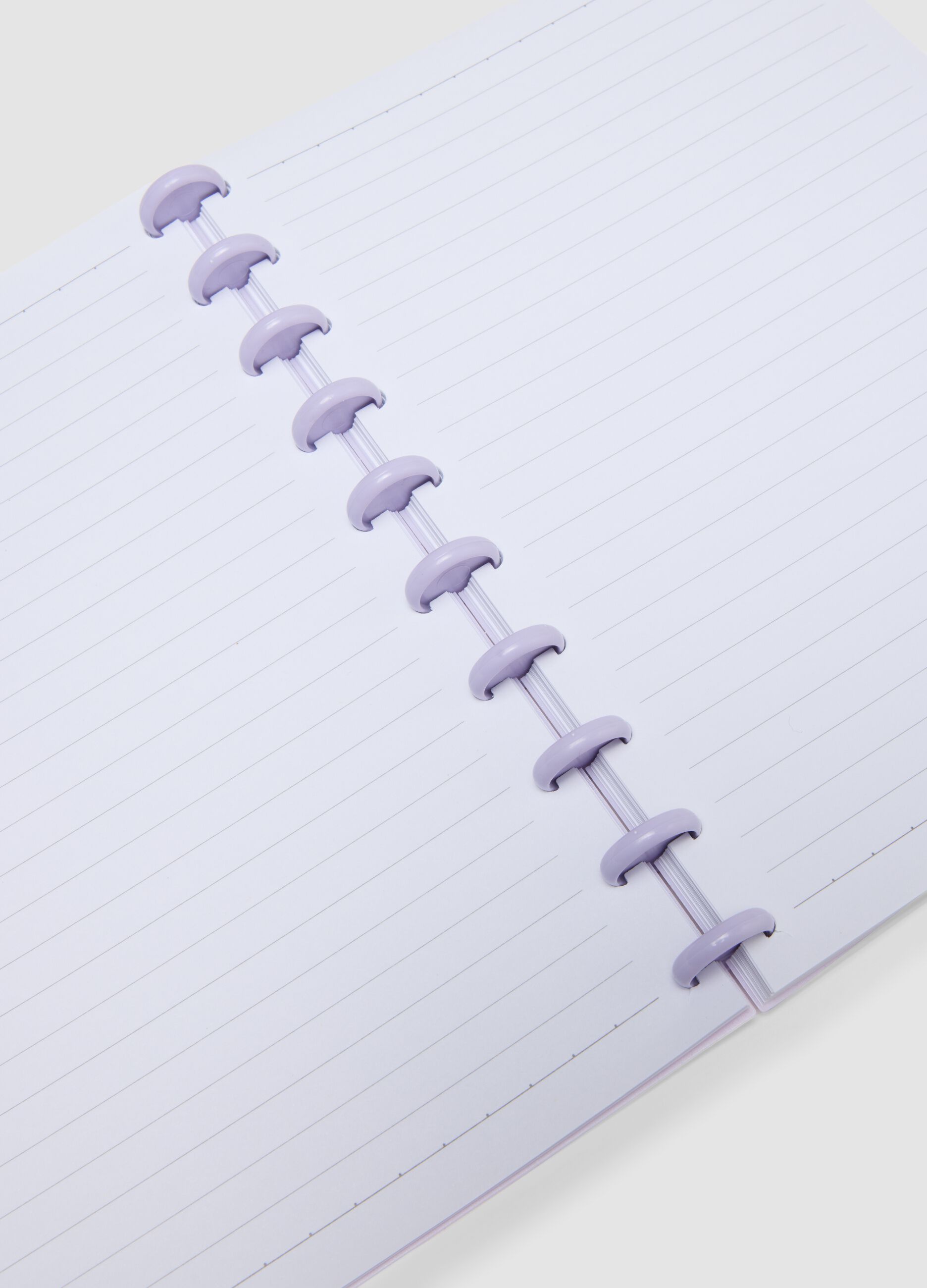 Purple notebook with lined pages in rigid cardboard with spiral