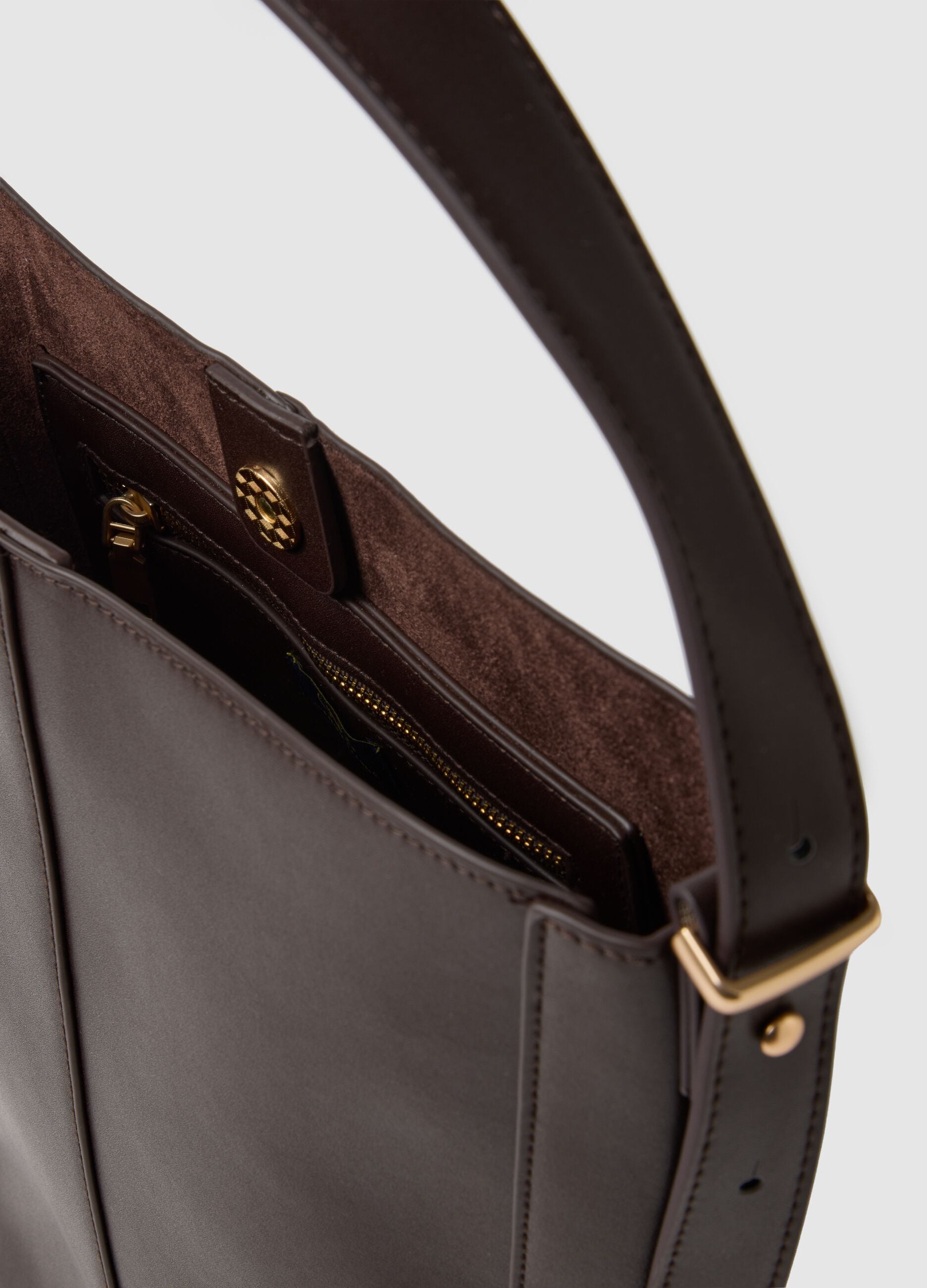 Brown bucket bag with golden details