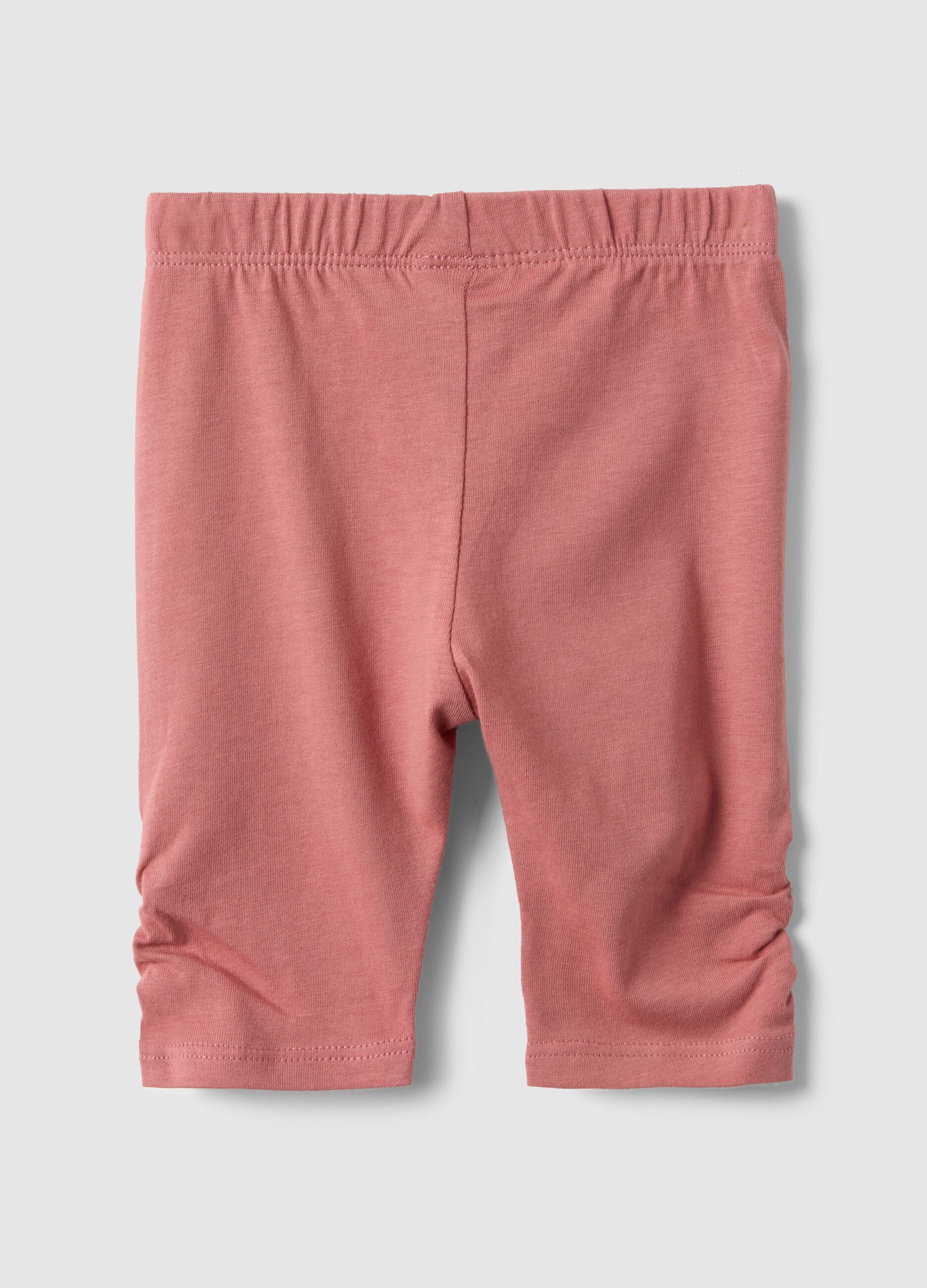 Slim fit pink cotton leggings for newborns with crumpled design