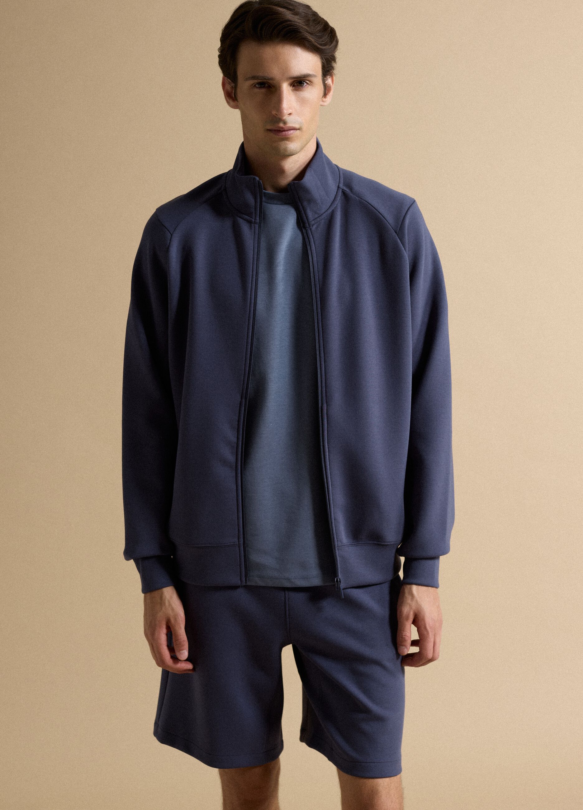 Blue full-zip jacket with stretch Easy Dry fabric collar, regular fit