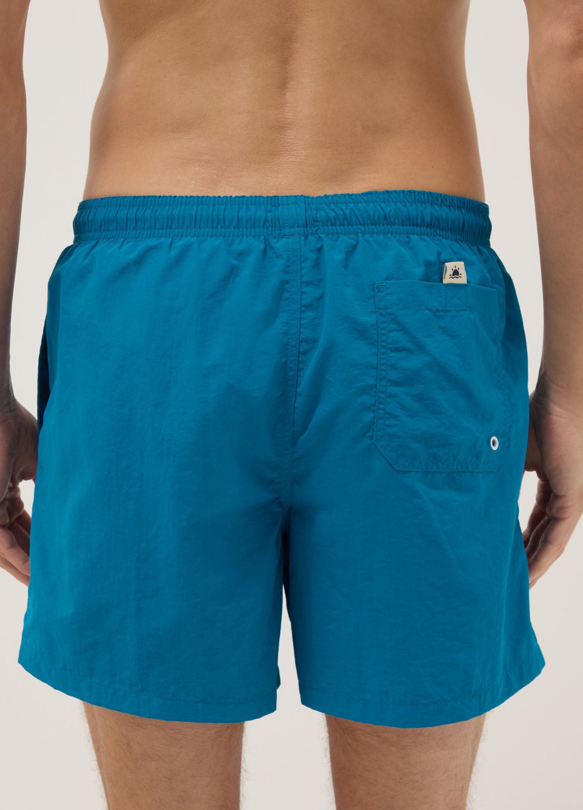 Blue swim shorts with elasticated waist