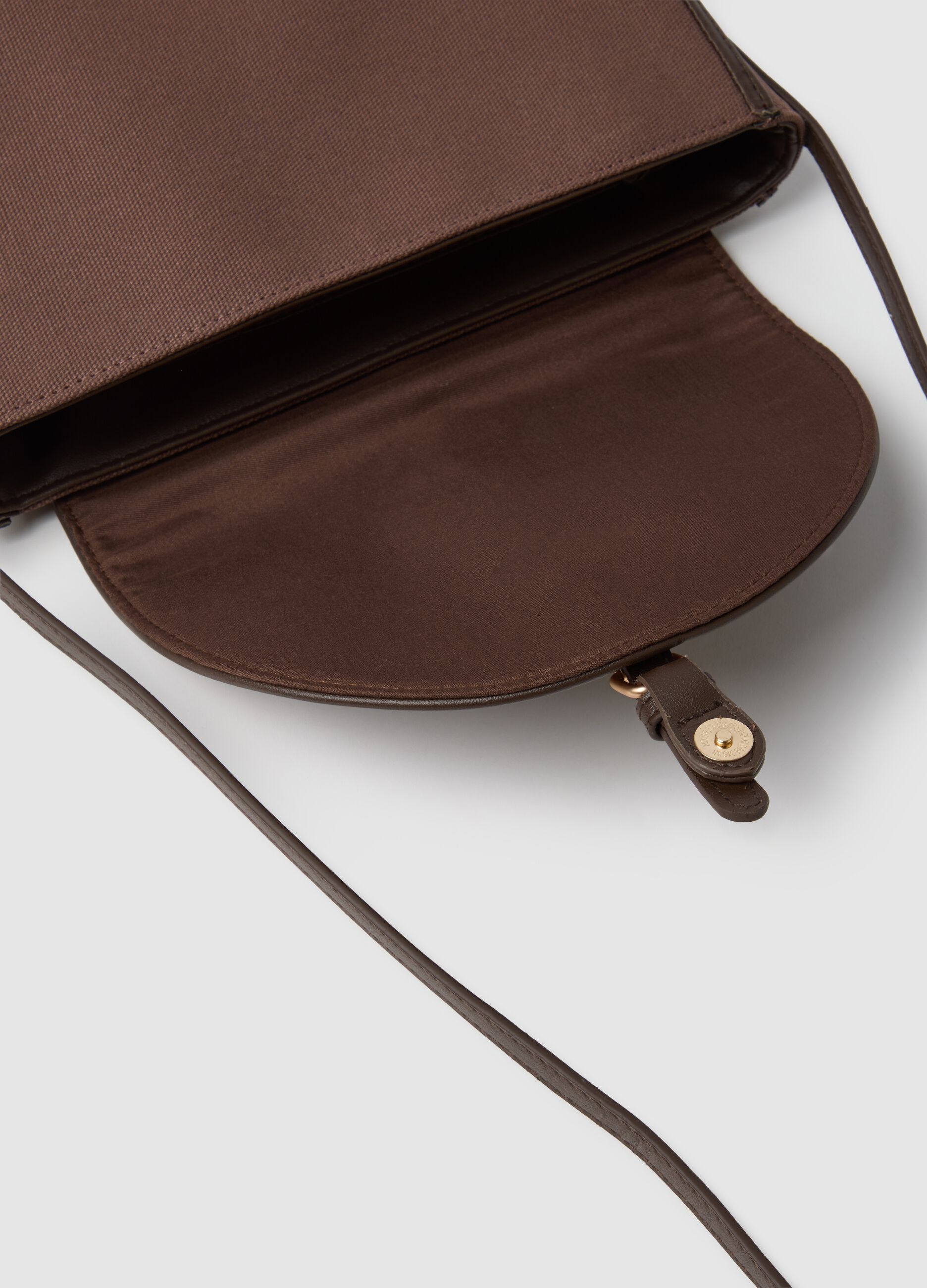 Brown shoulder bag with gold buckle and adjustable strap