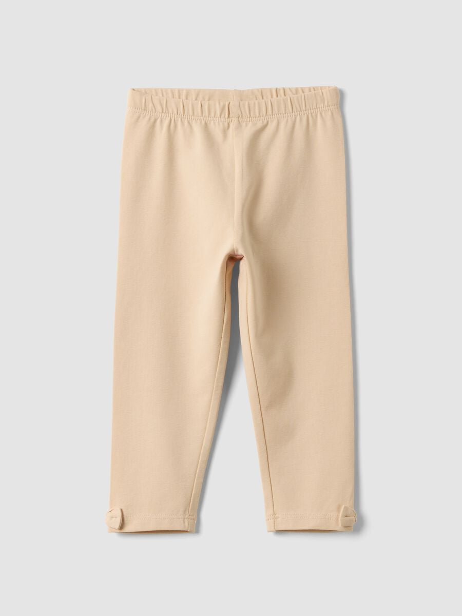 Beige stretch organic cotton leggings with bows for baby girl_0