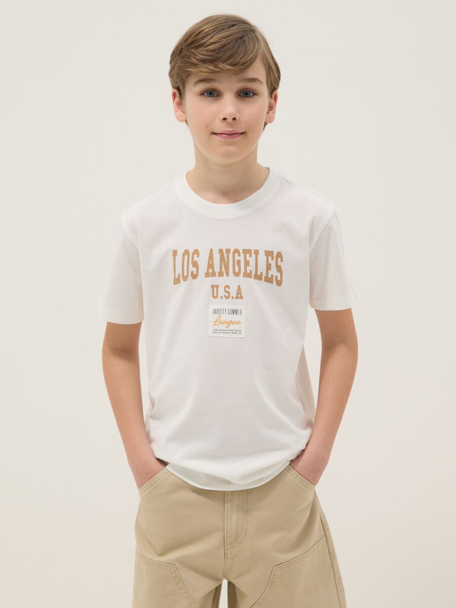 T-shirt in puro cotone bianca da ragazzo regular fit con stampa_0