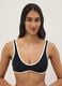 Black stretch fabric bikini top with white trim_0