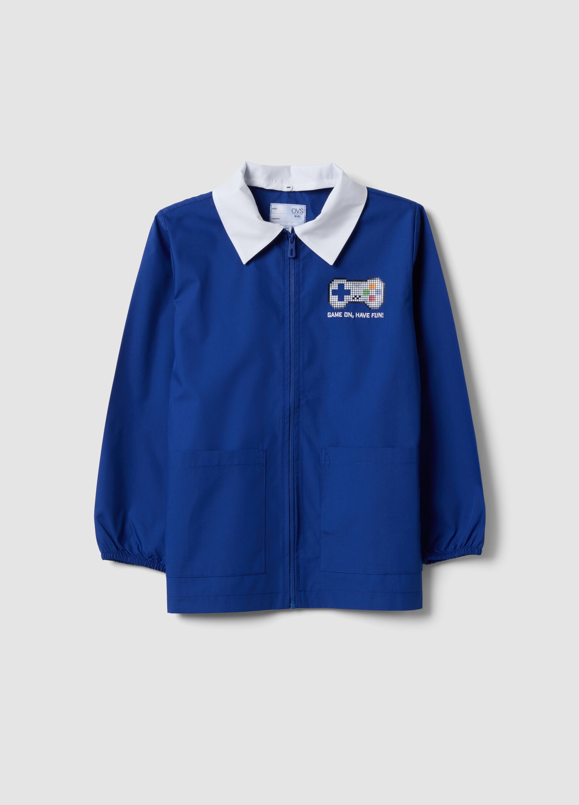 Blue kids&rsquo; school smock with gaming print and white collar