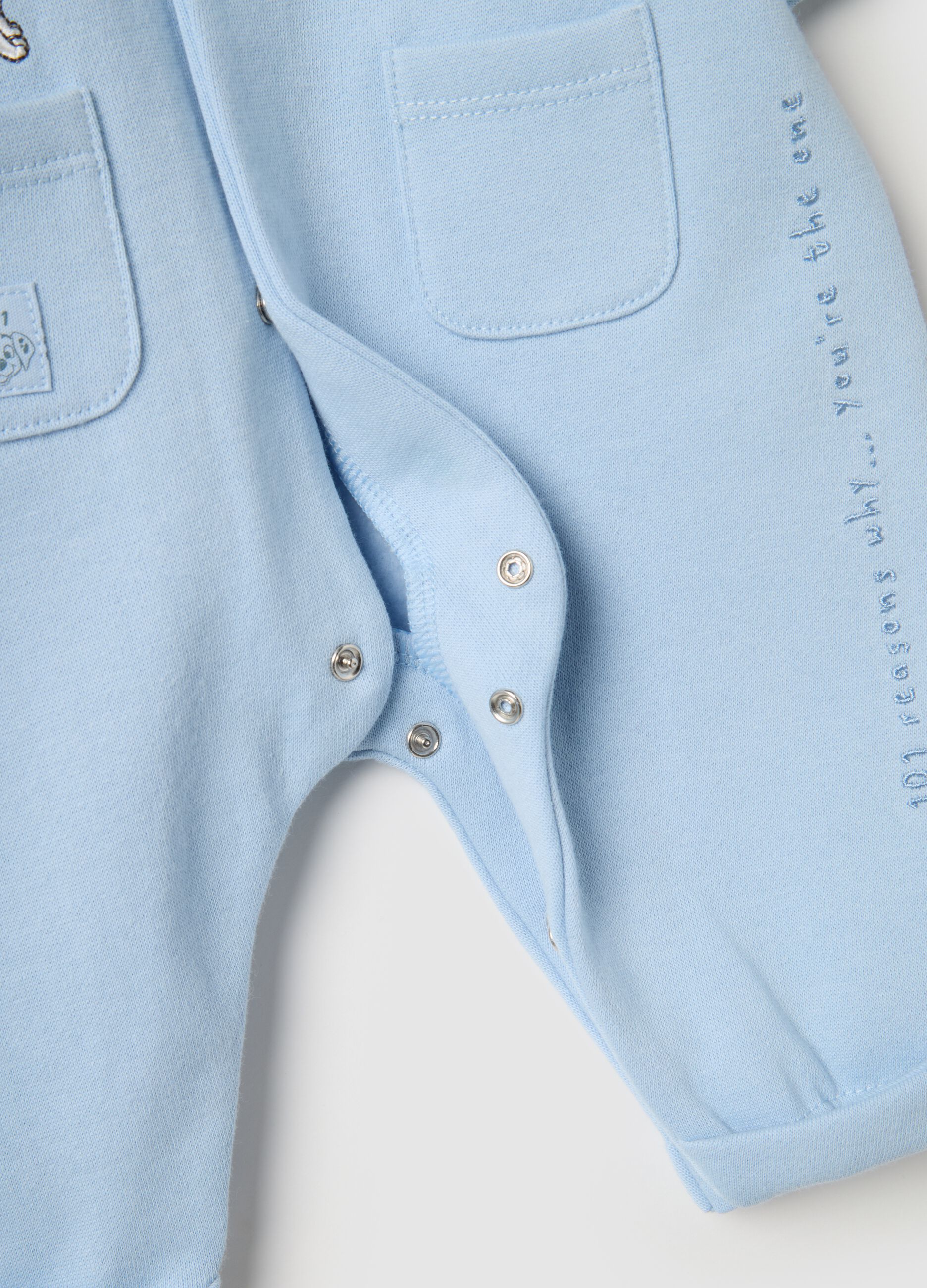 Baby blue romper in pure cotton with appliqu&eacute;s
