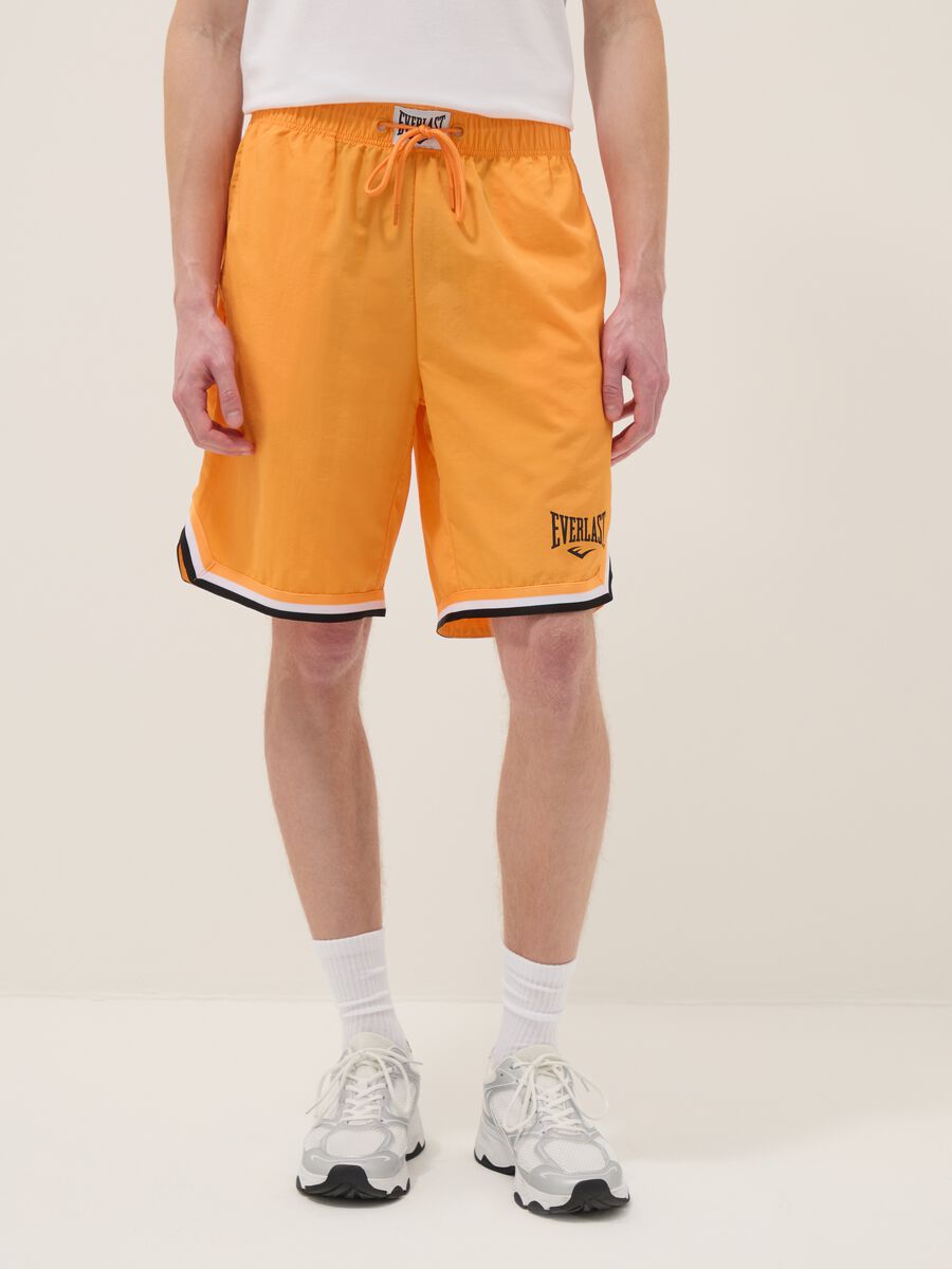Orange regular fit sports shorts with white and black details_1