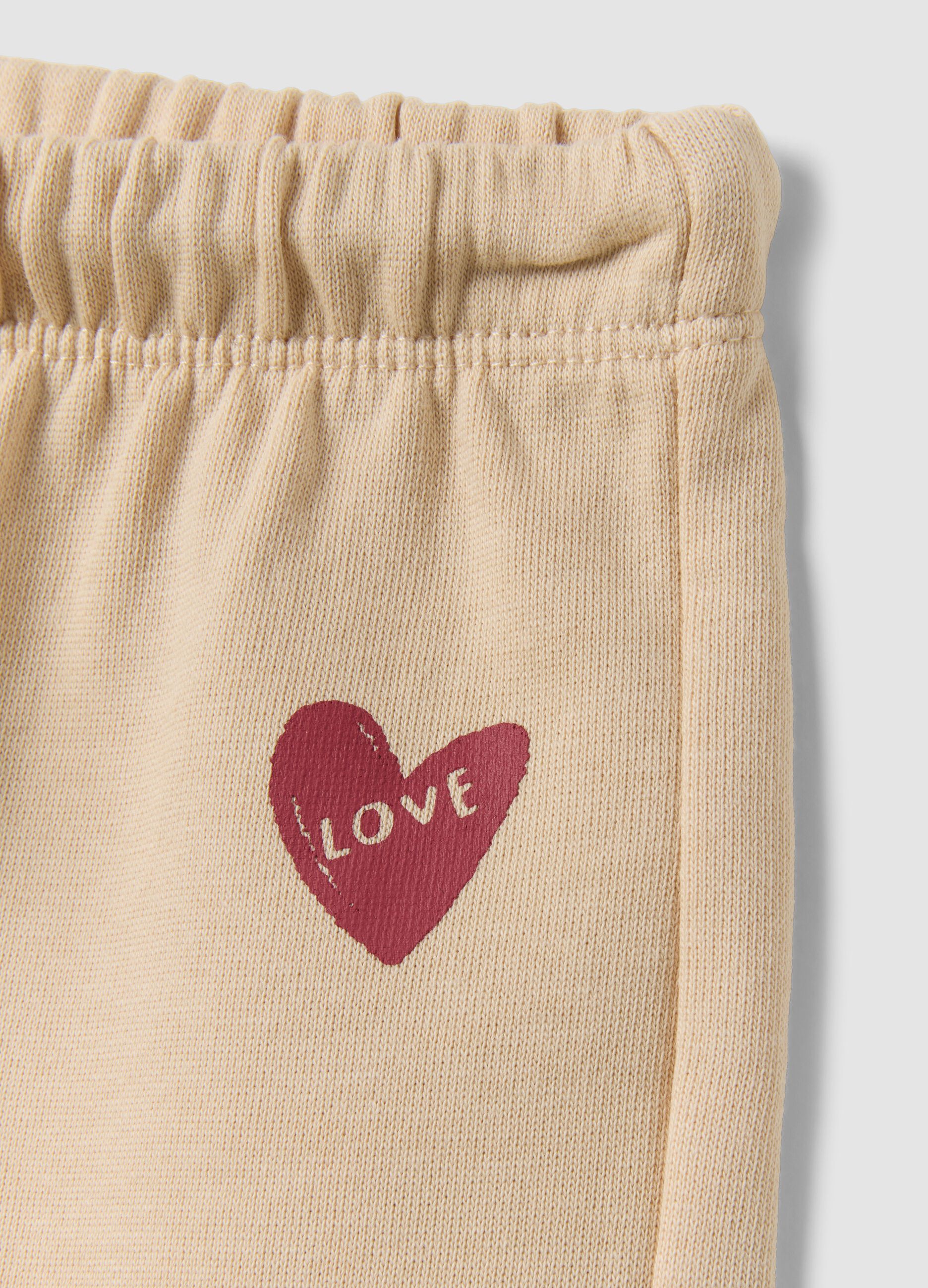 Beige pure cotton trousers with elasticated waist and print for baby girl