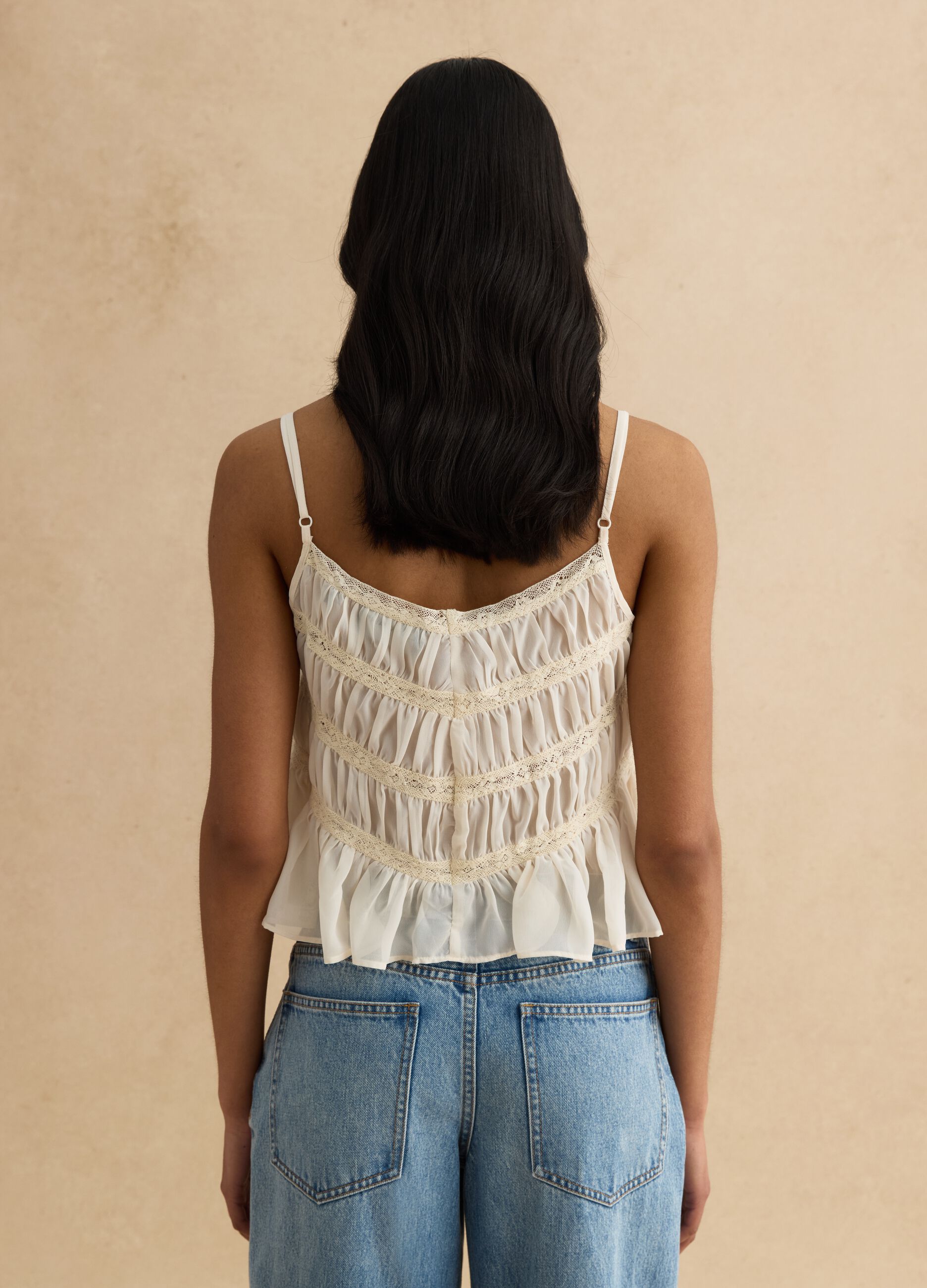 Sleeveless top with ruffled shirring and crochet lace inserts