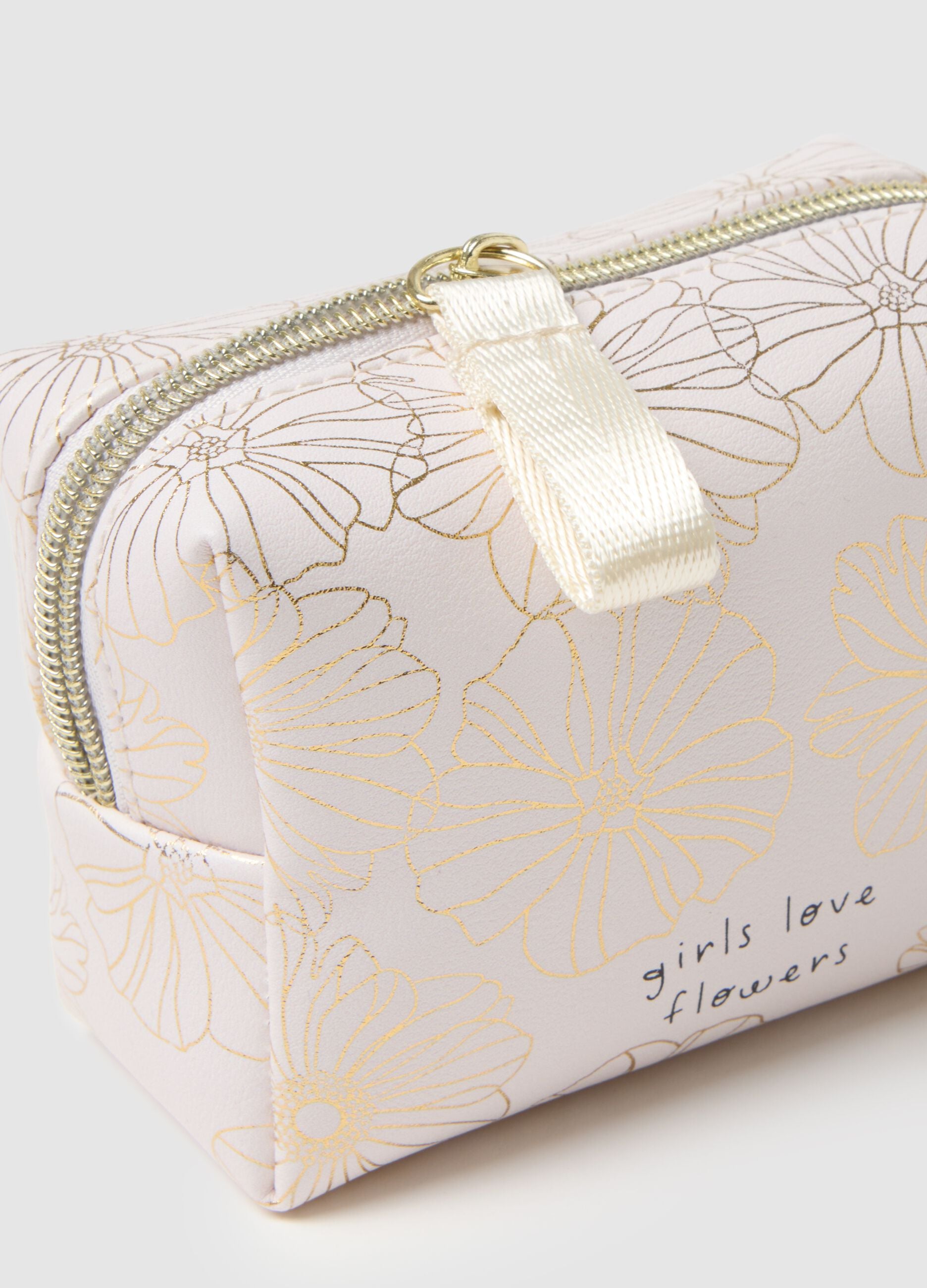 White toiletry bag with zip and floral design