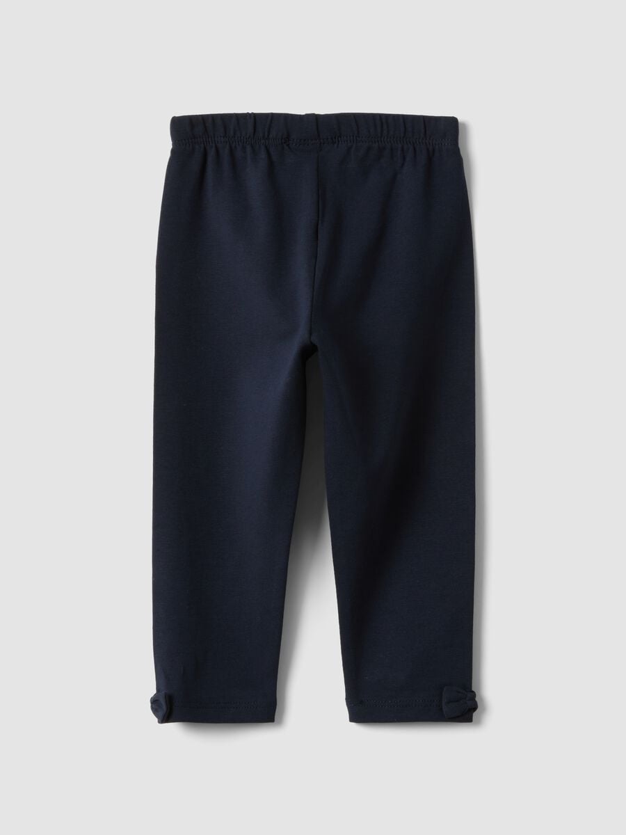 Blue stretch organic cotton leggings with bows for baby girl_1