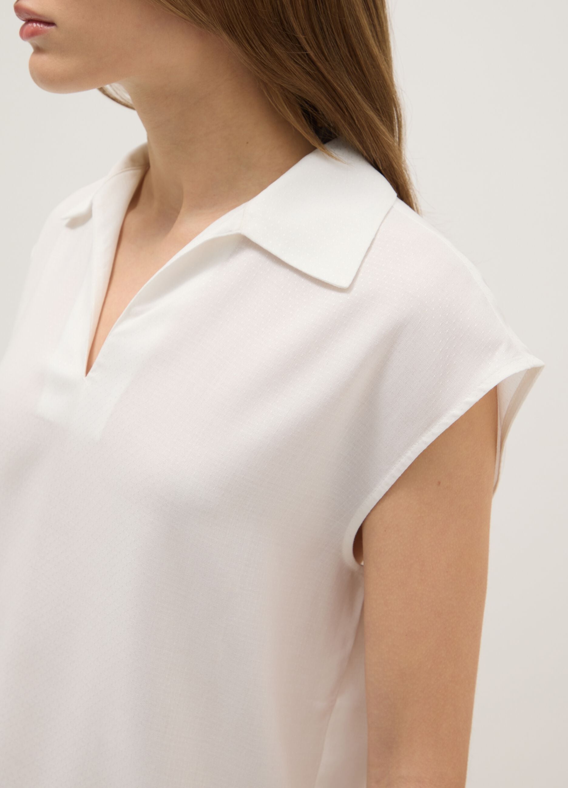 White sleeveless blouse in pure viscose regular fit with V-neck