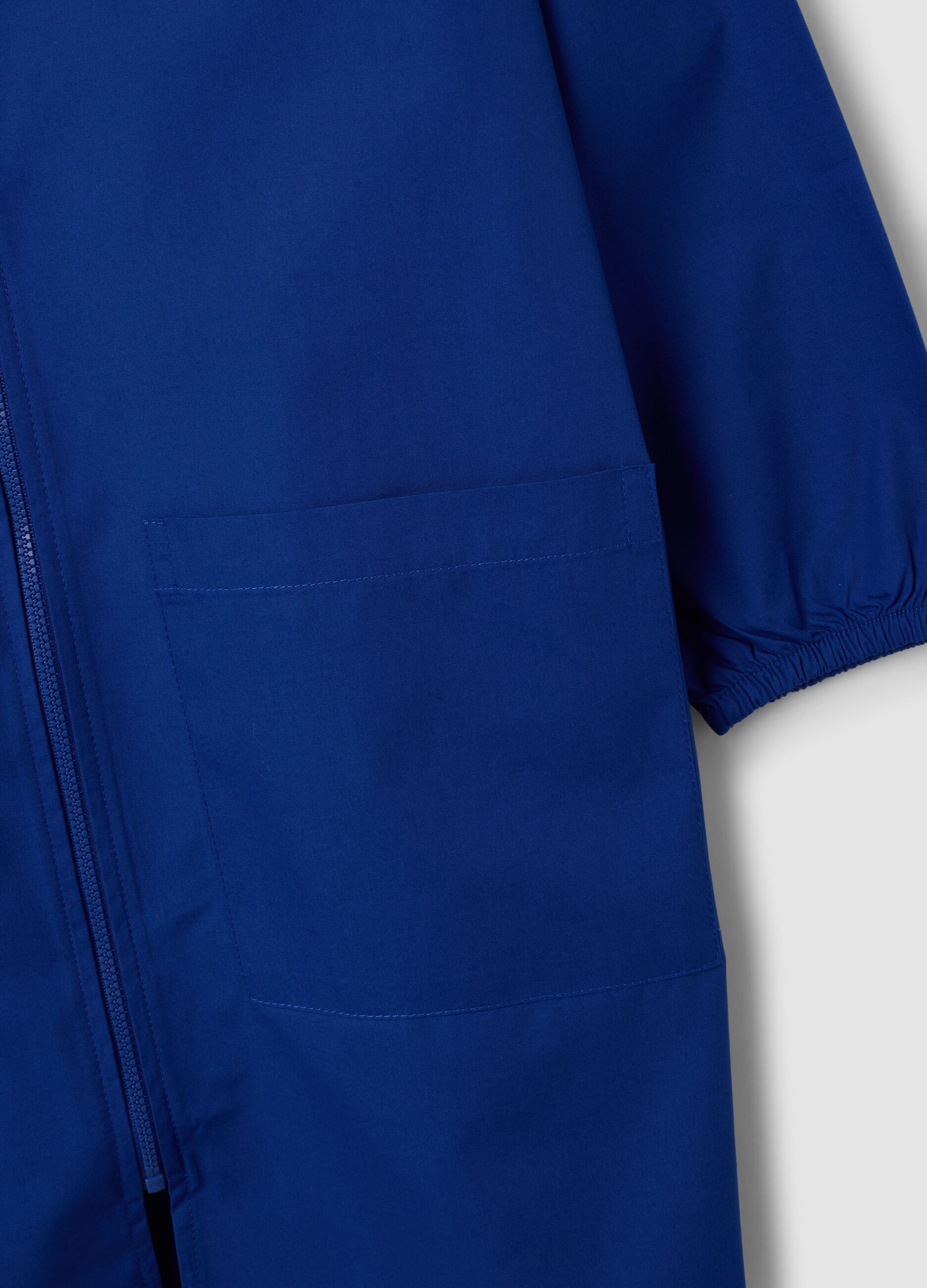 Blue boys&rsquo; school apron with zip and go-kart embroidery