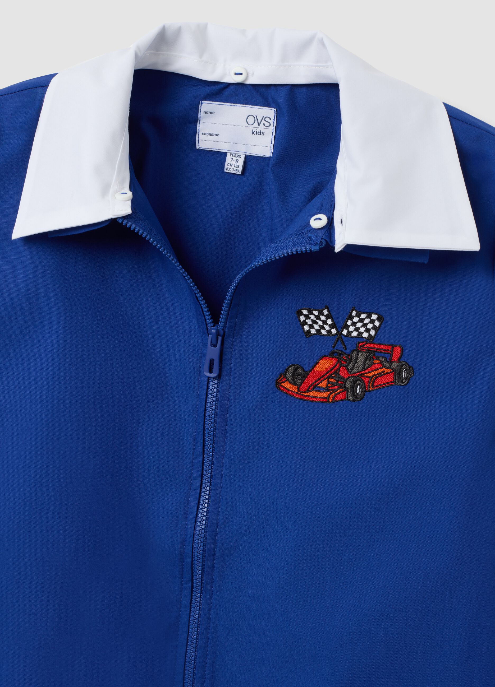 Blue boys&rsquo; school apron with zip and go-kart embroidery