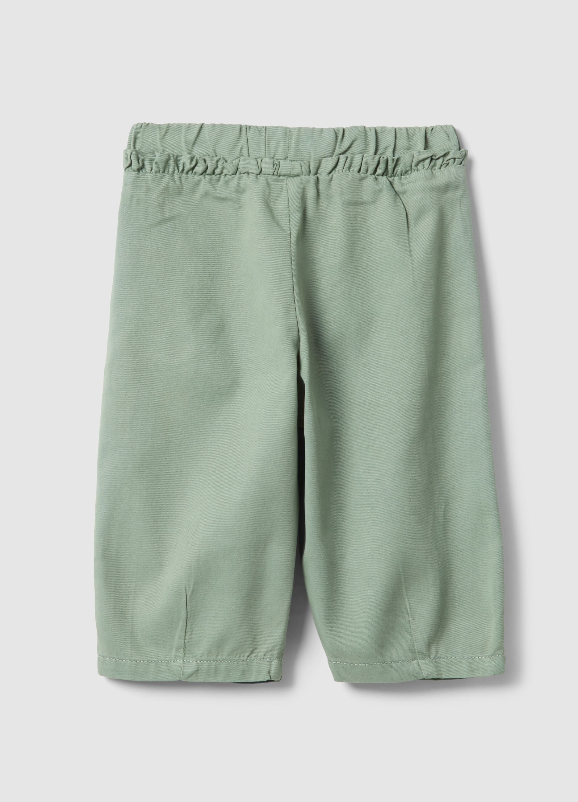 Green girl's baggy trousers in lyocell and cotton