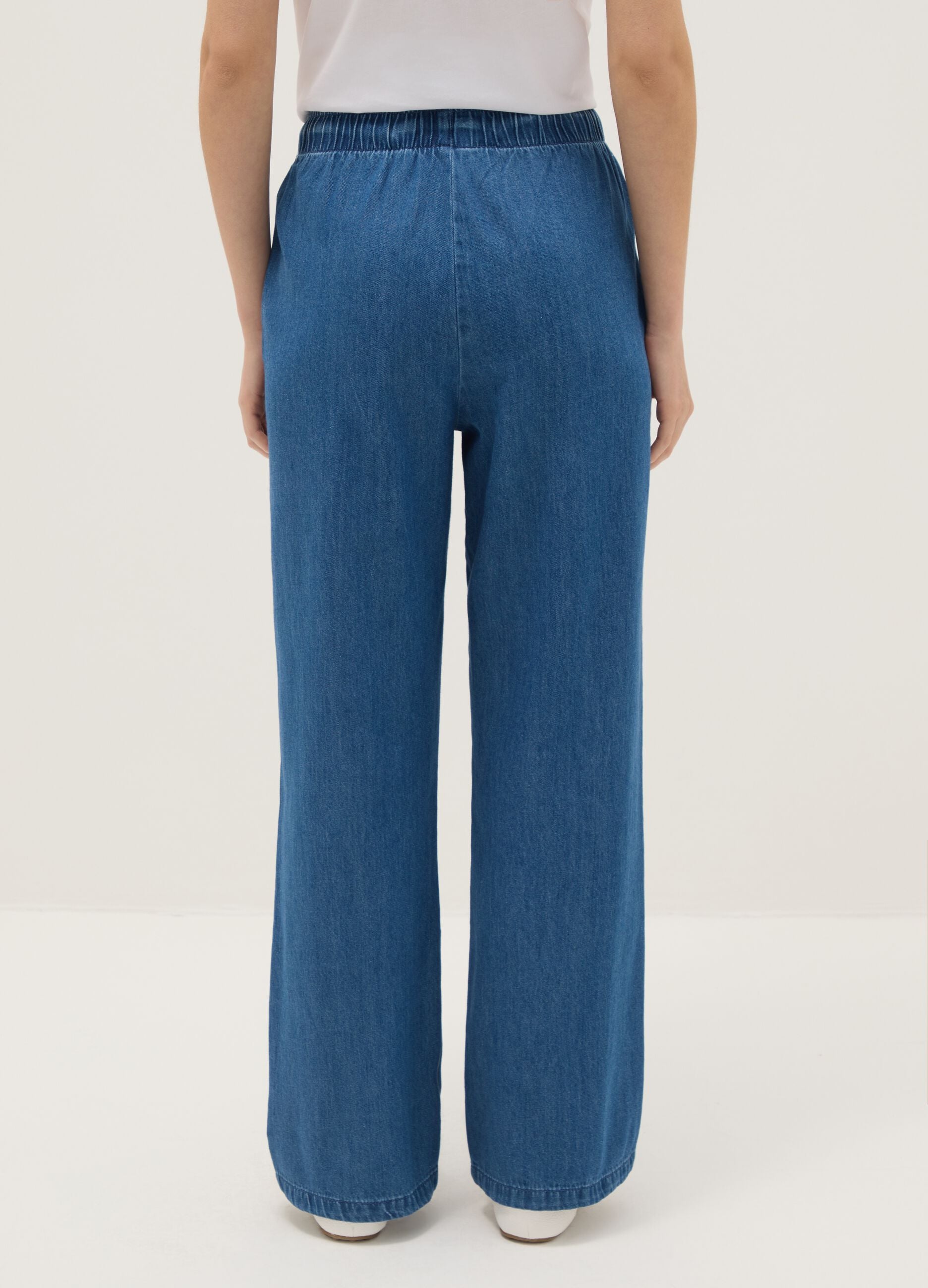 Pantaloni in puro cotone denim blu wide leg con elastico in vita