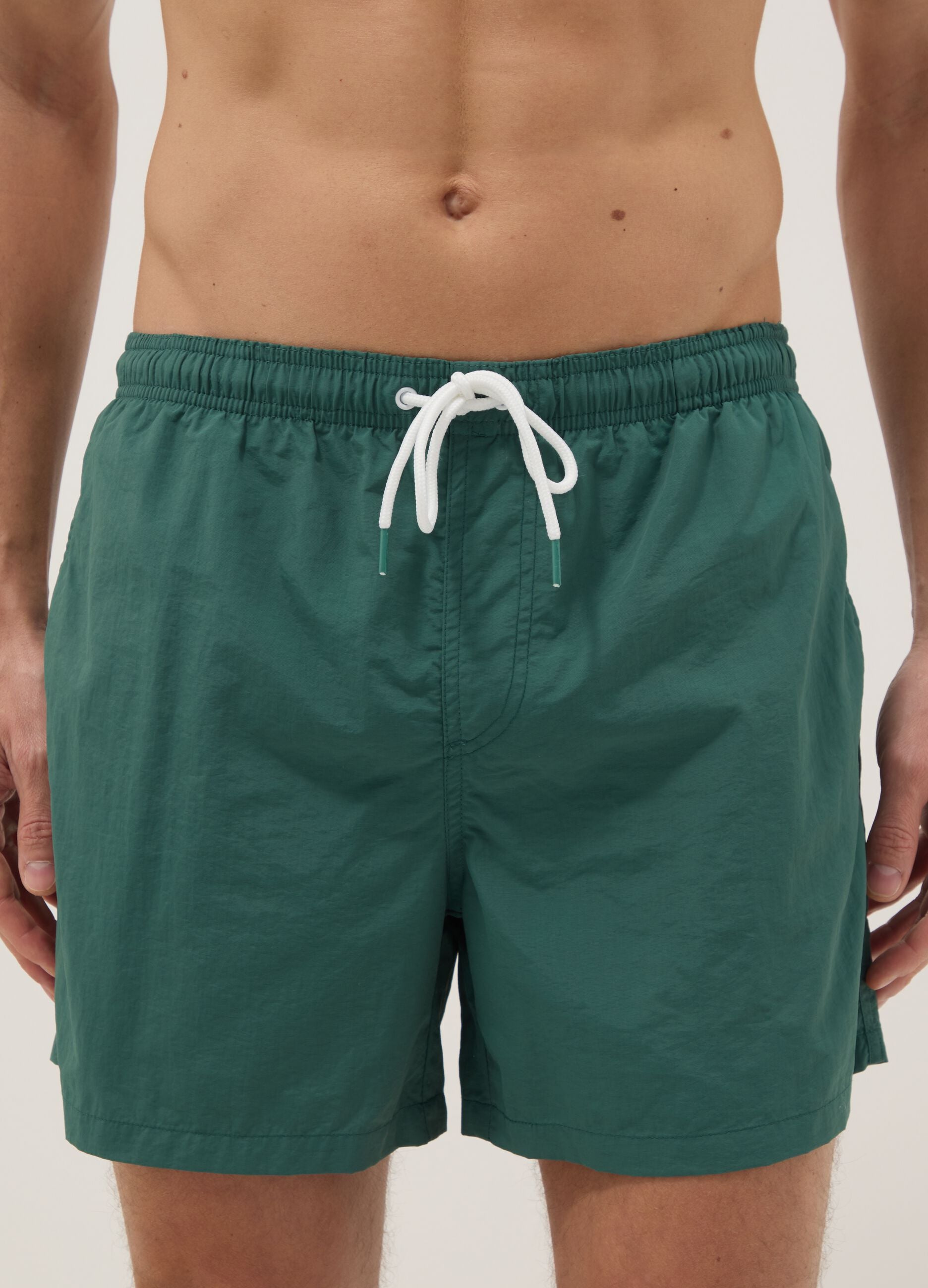 Green swim shorts with elasticated waist