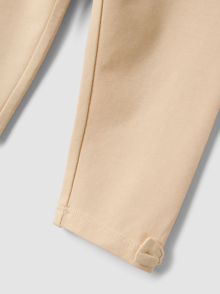 Beige stretch organic cotton leggings with bows for baby girl_2