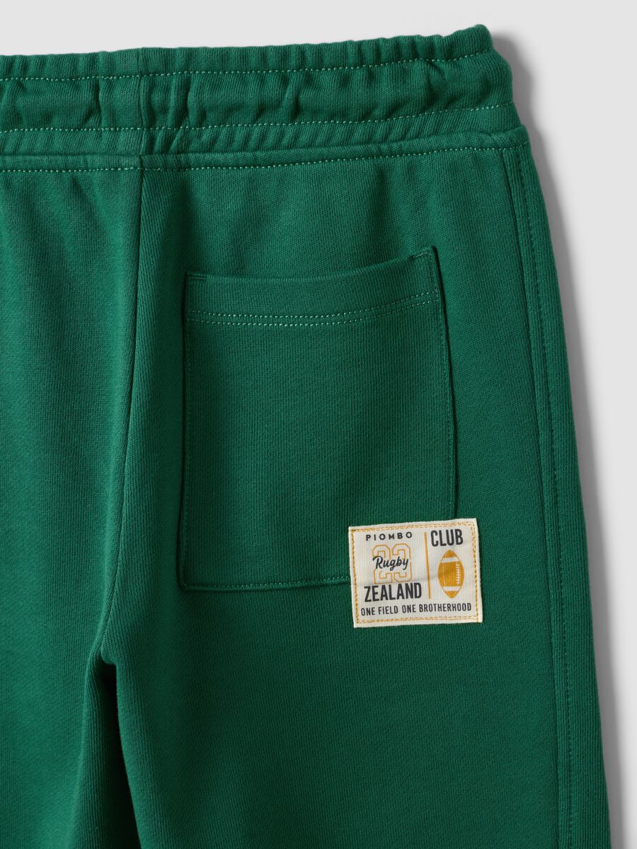 Green pure cotton jogger trousers with elasticated waist for boys_6