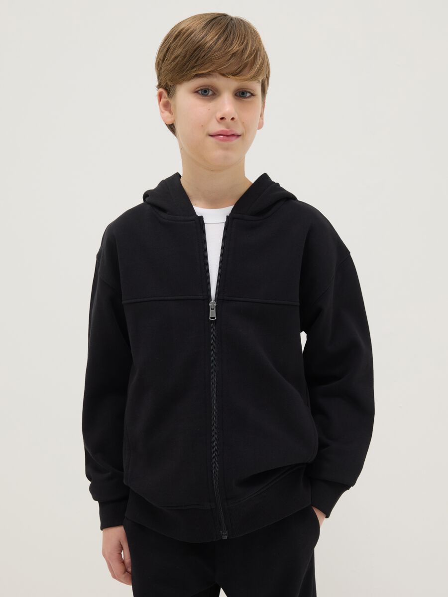 Black sweatshirt for boys in pure cotton with oversized fit, hood and zip_0