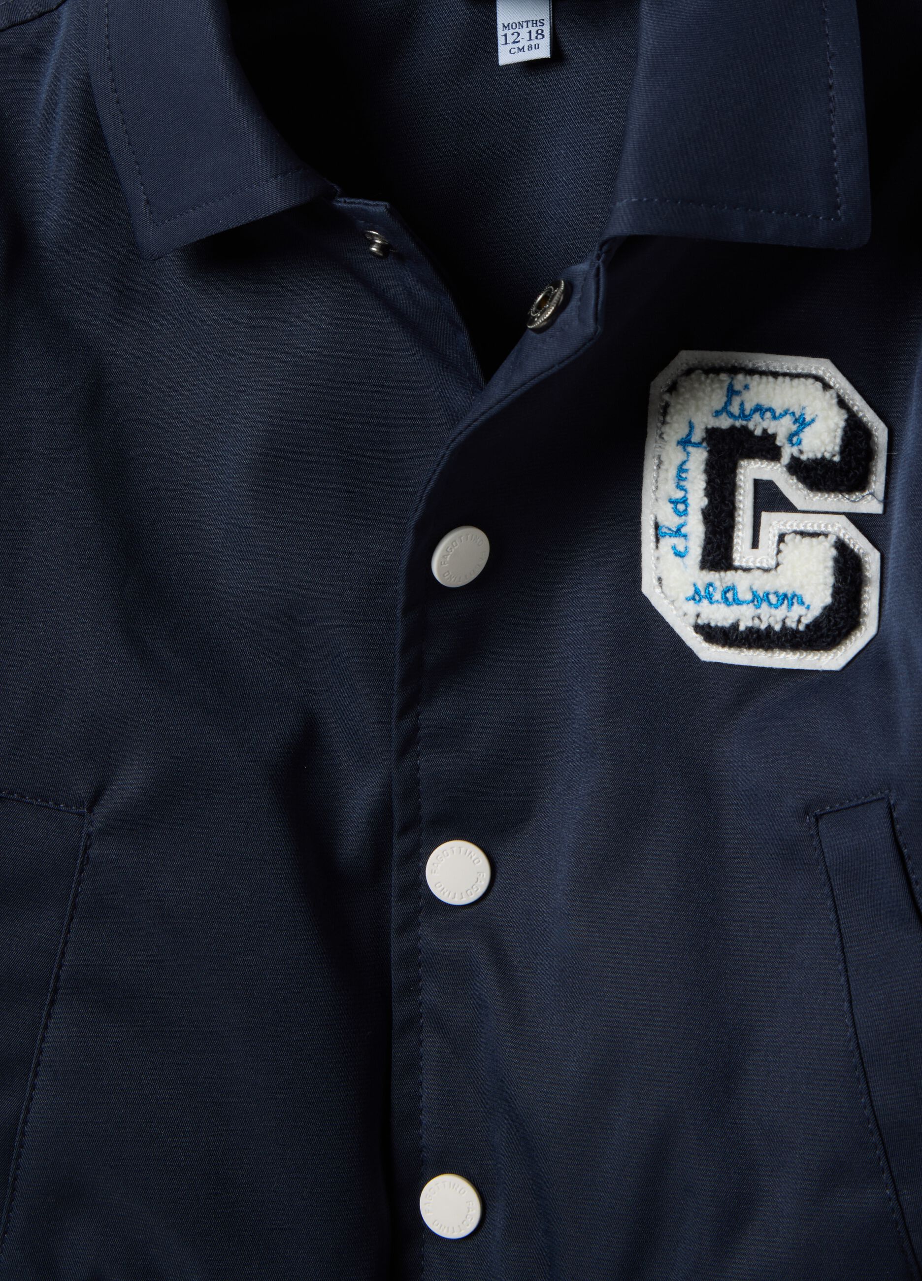 Regular fit blue jacket with striped cuffs for boys