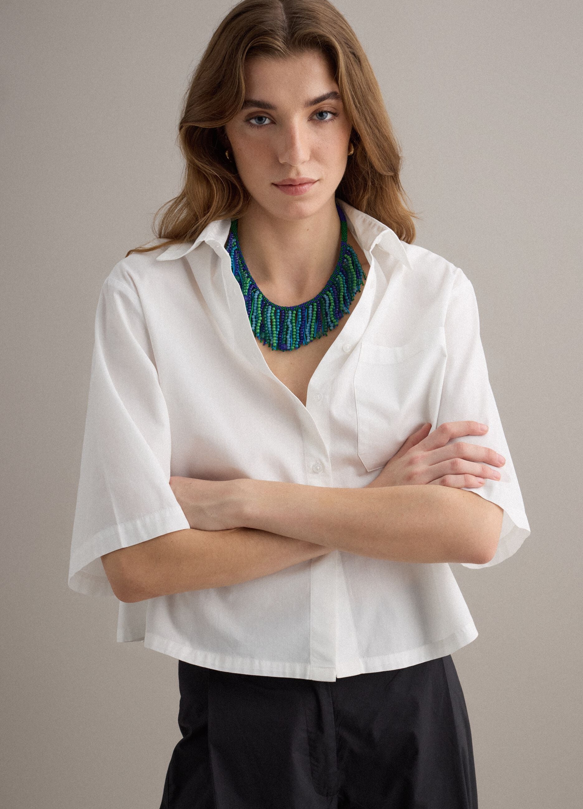 White pure-cotton shirt with patch pocket and oversized fit