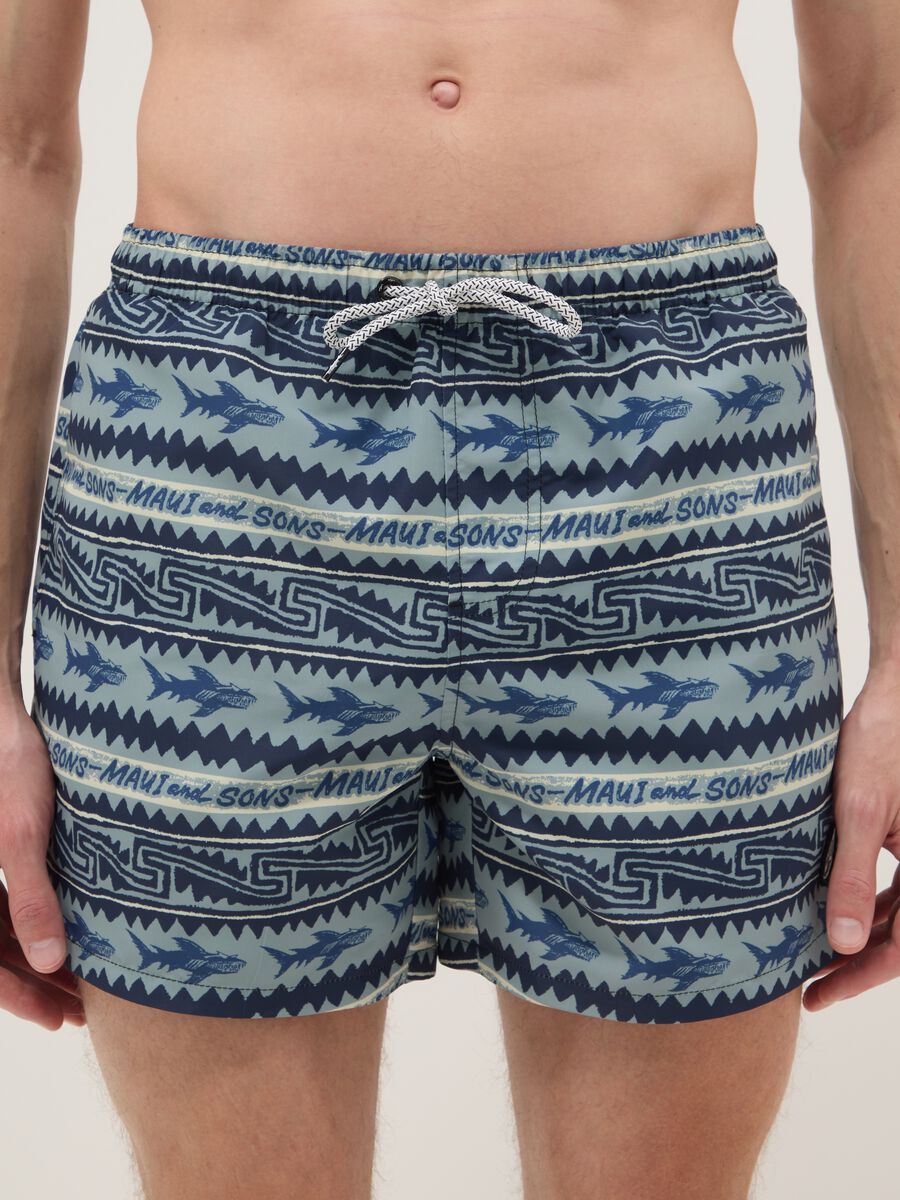 Multicolour swim shorts with sharks and geometric patterns_1